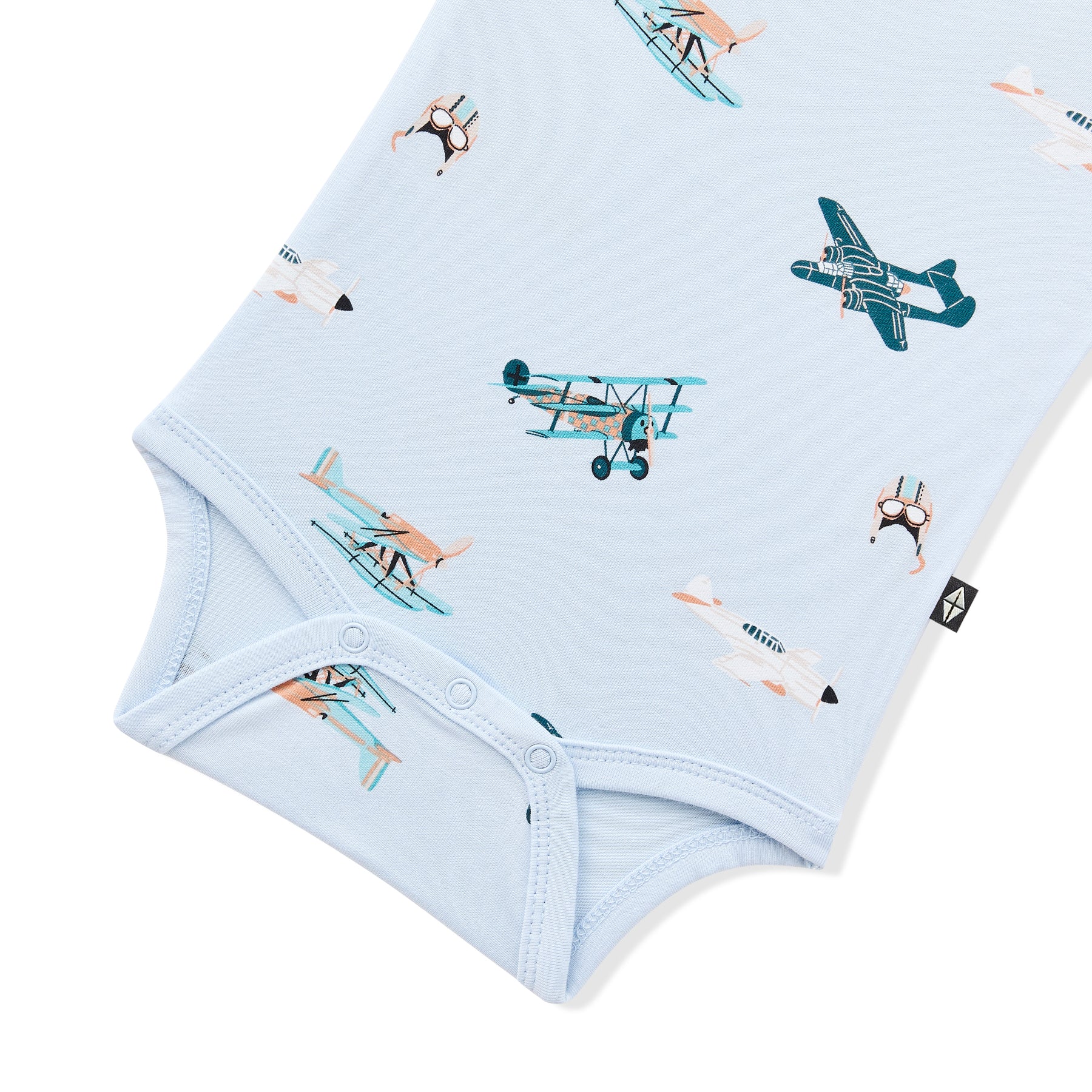 Close up of the snap closure on the Bodysuit in Take Off