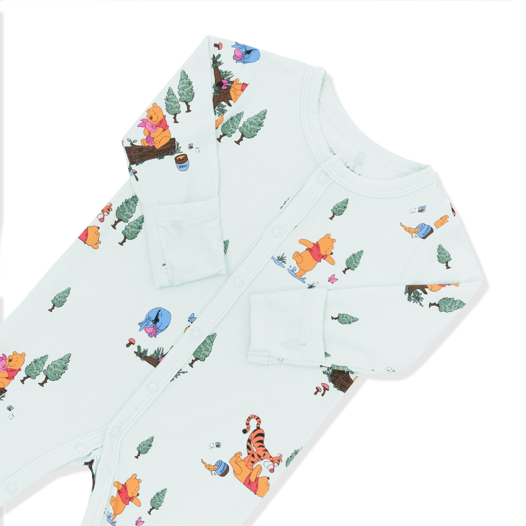 Close up of the snap closures and fold over hand cuffs shown on the Romper in Winnie the Pooh Hundred Acre Wood