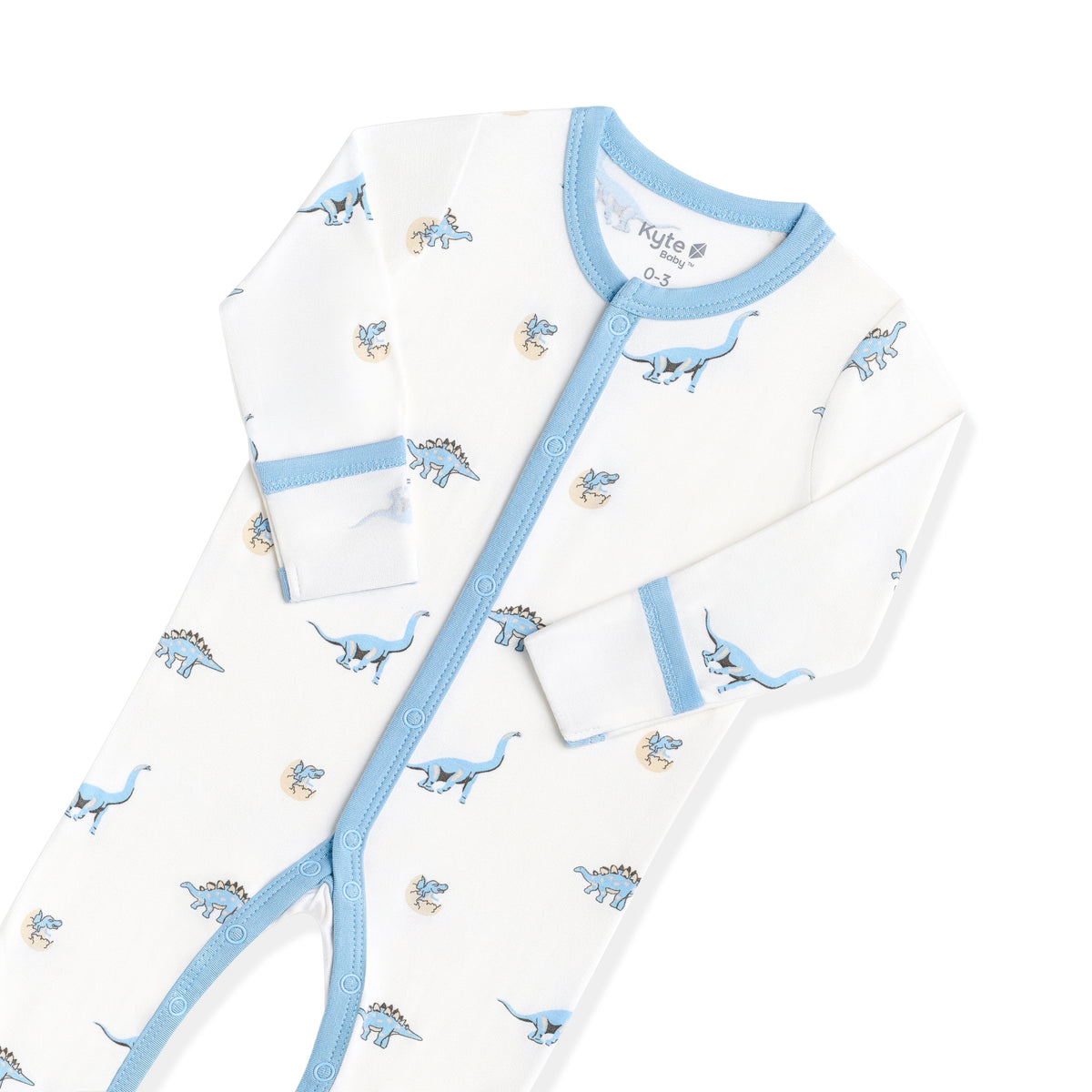 Close up of the snap closures and the fold over hand cuffs on the Footie in Jurassic