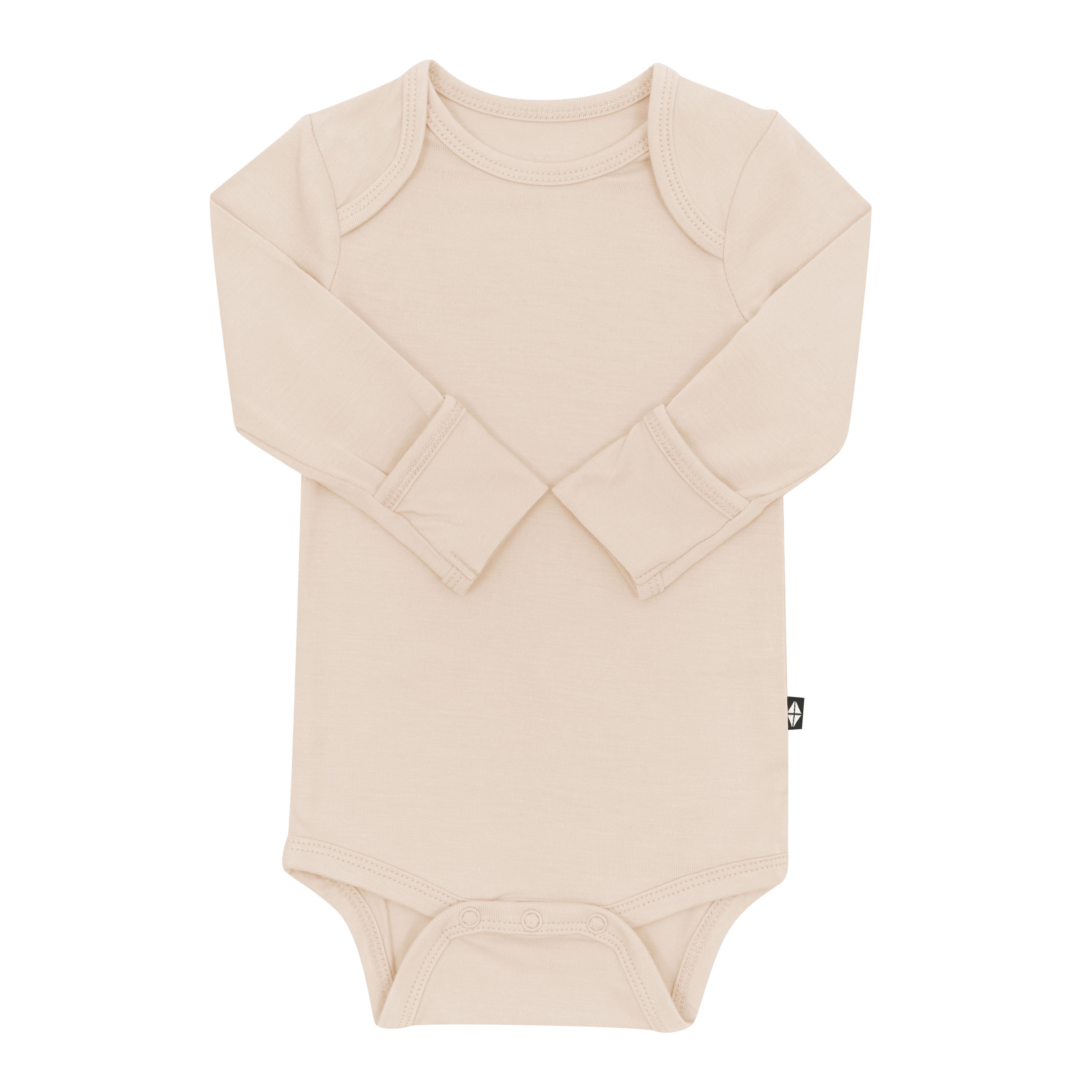 Long Sleeve Bodysuit in Bisque with the arms folded inwards showing the fold over hand cuffs