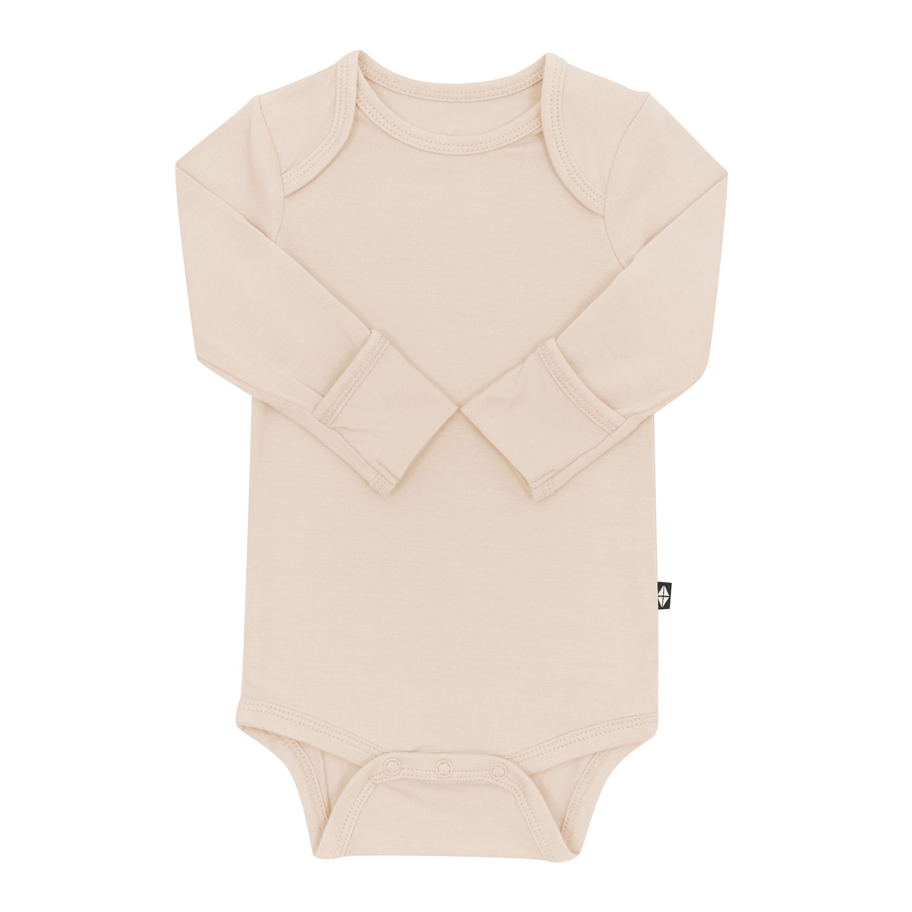 Long Sleeve Bodysuit in Bisque with the arms folded inwards showing the fold over hand cuffs