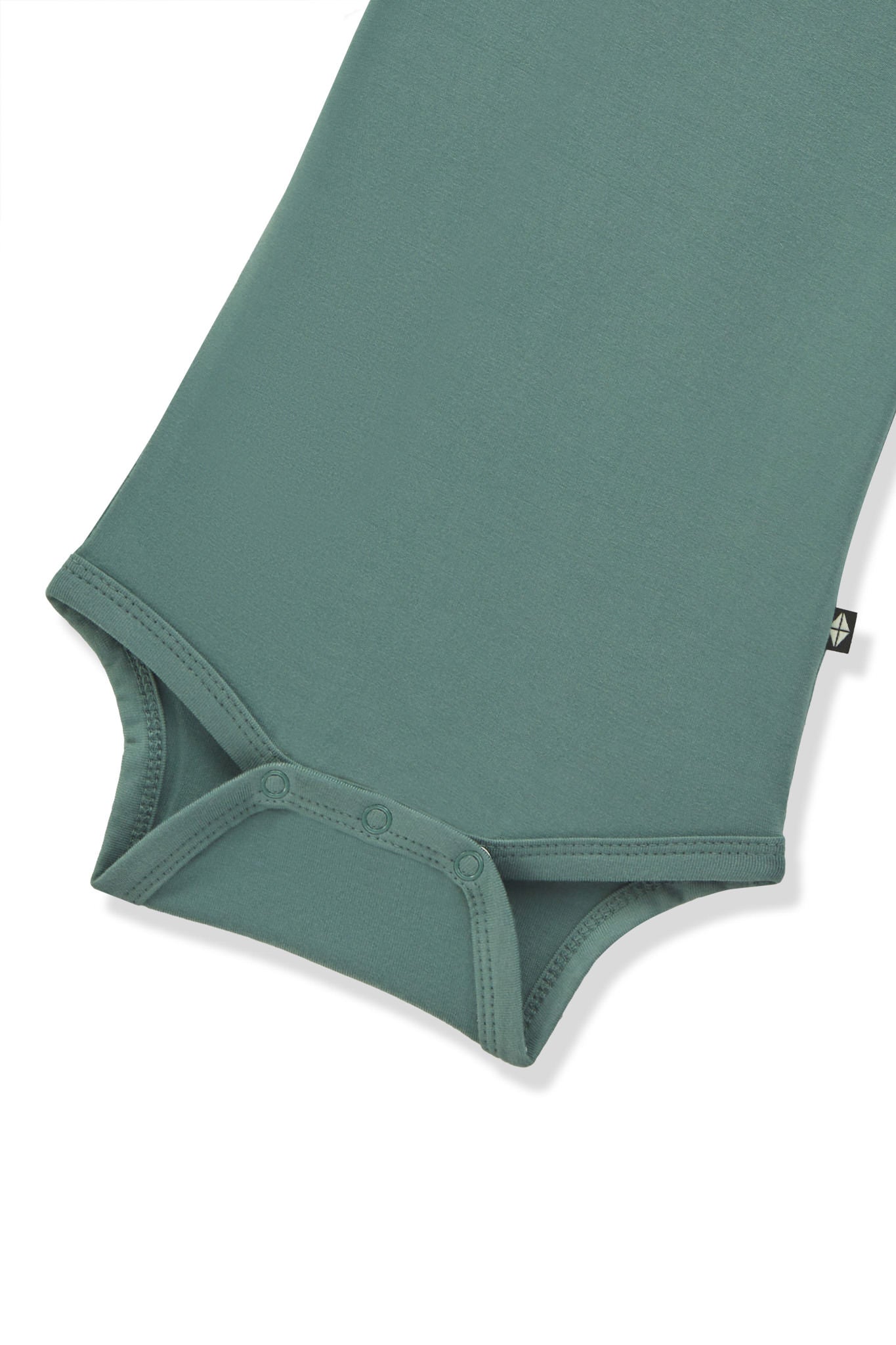 Bottom part of Long Sleeve Bodysuit in Pine with snap buttons on a white background