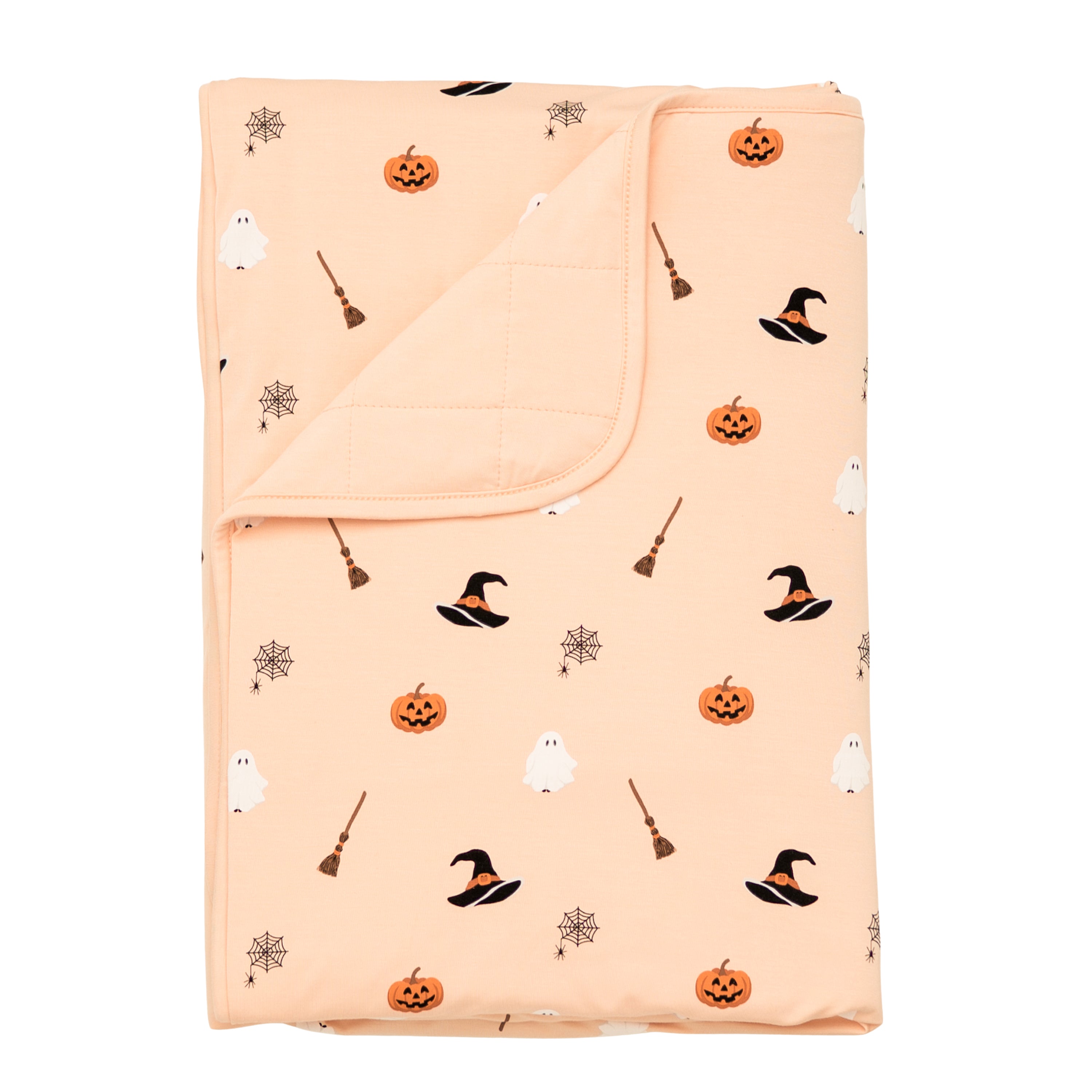 Toddler Blanket in Bewitched 1.0 shown with the corner flipped down showing the Canyon colored backing