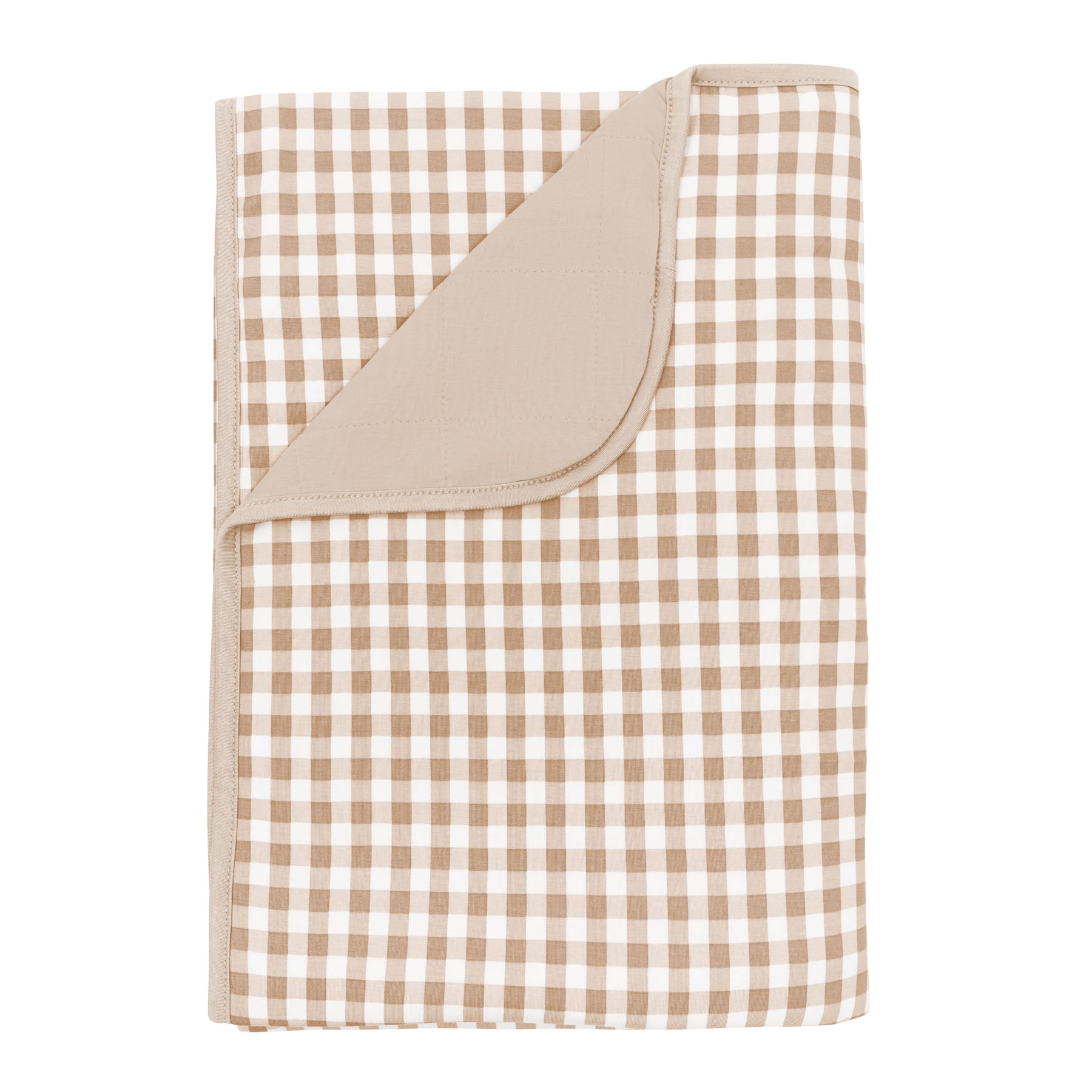 Toddler Blanket in Gingham Bisque 1.0 with corner flipped down showing the Bisque colored backing