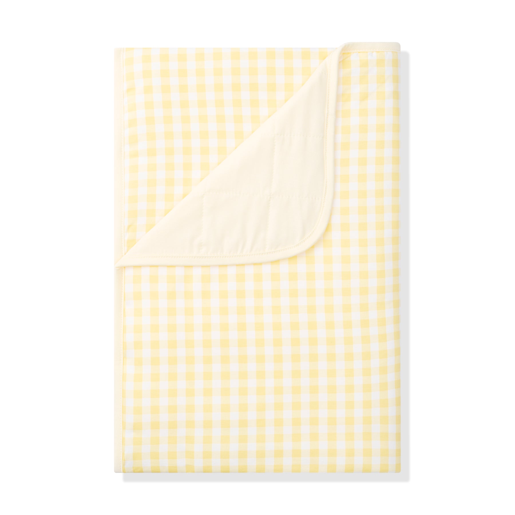 Toddler Blanket in Gingham Chamomile 1.0 with the corner flipped down showing the light yellow backing