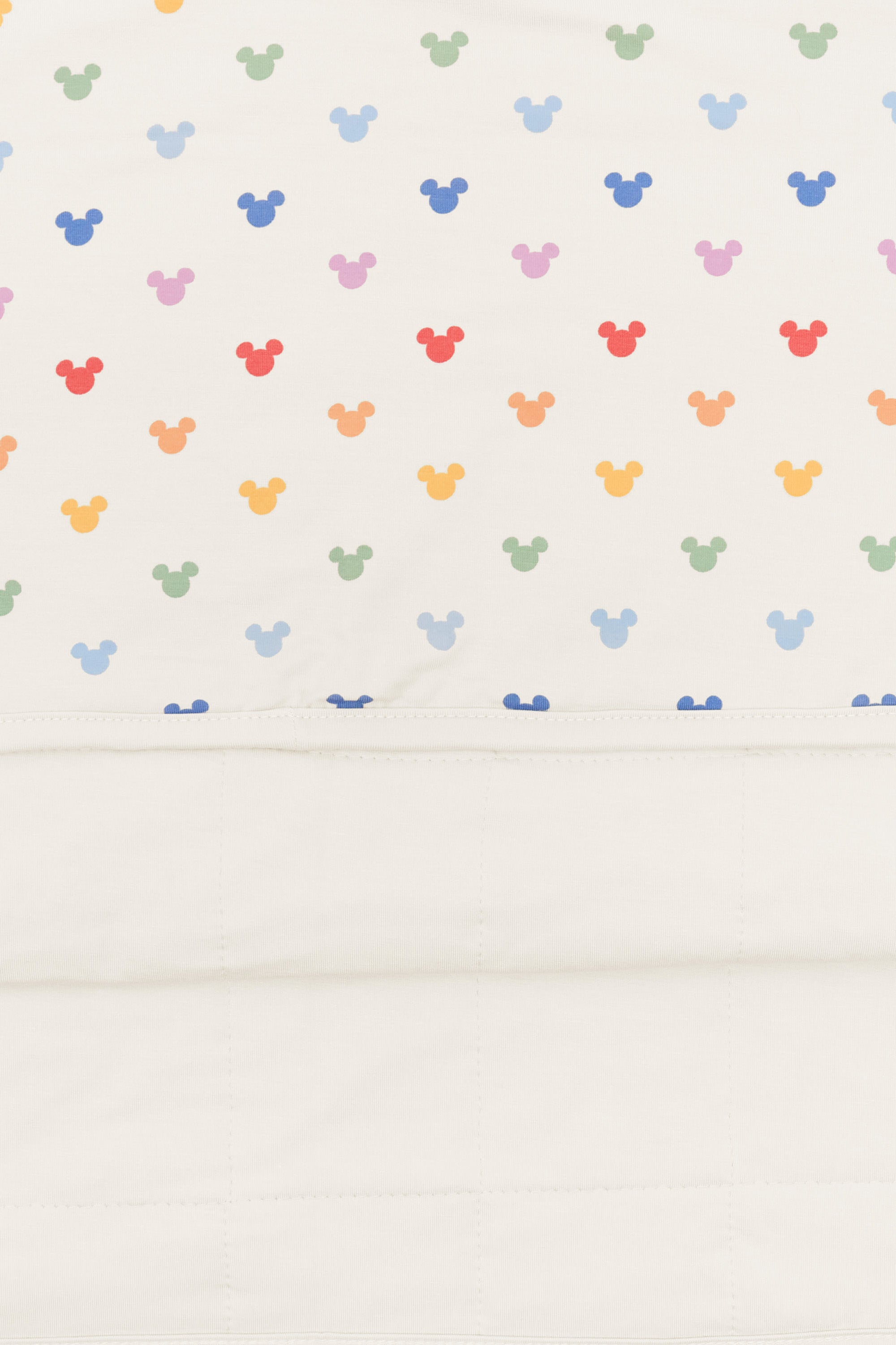 Back side fabric of Toddler Blanket in Pastel Mickey Mouse pattern on an oat background