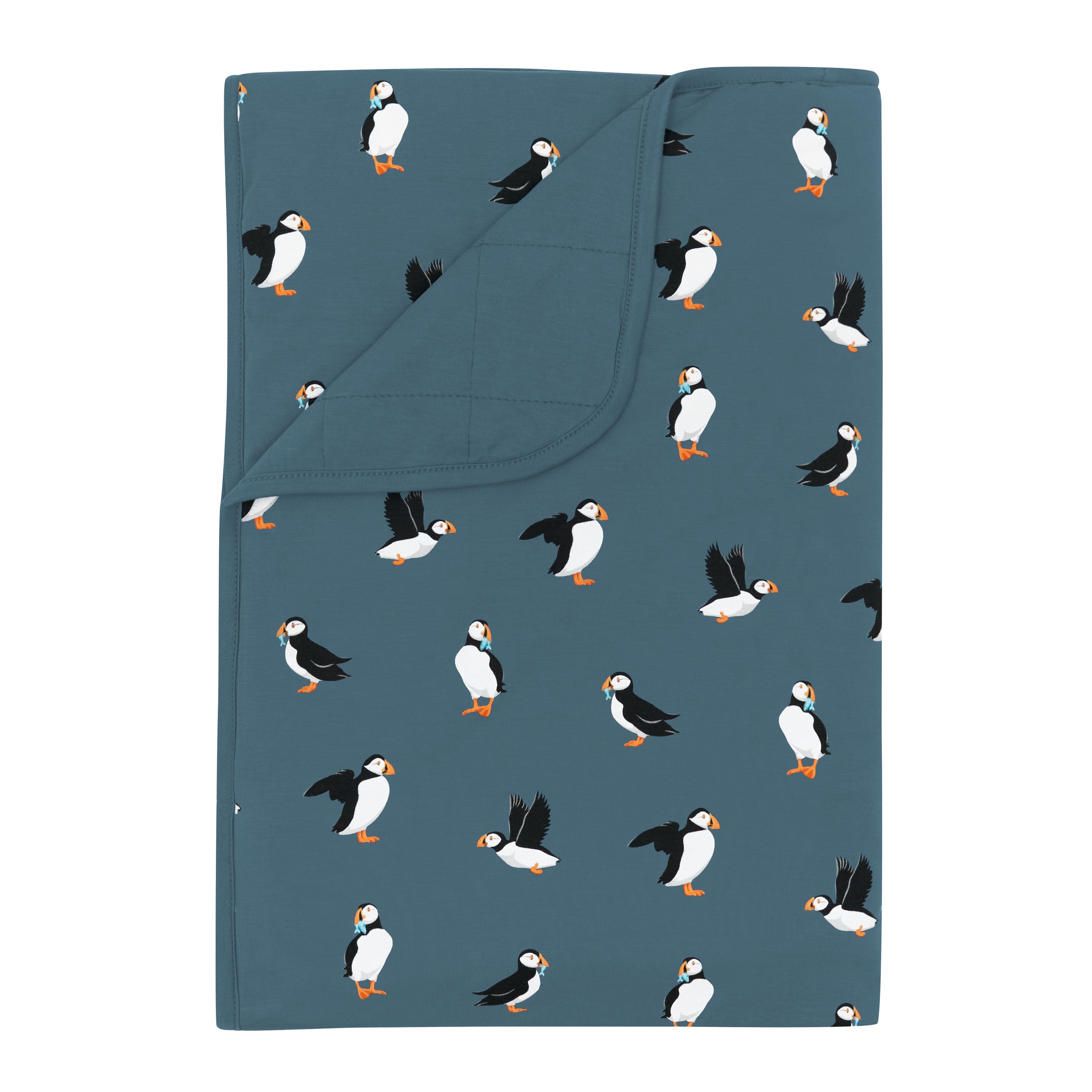 Toddler Blanket in Puffin 1.0 shown with the corner flipped down showing the Atlantic backing