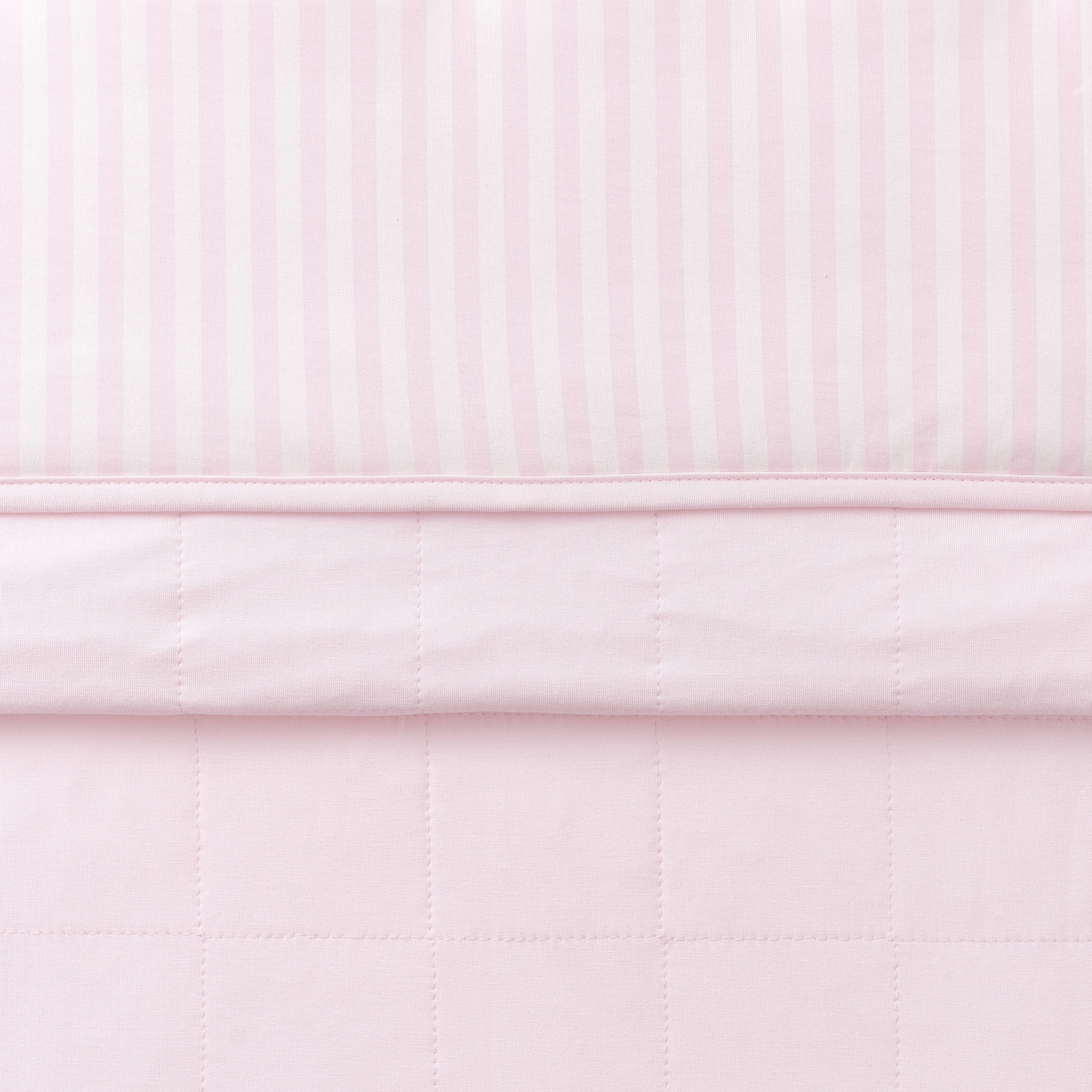 Toddler Blanket in Small Sakura Stripe 1.0 folded showing the quilted detail on the back of the blanket and the print detail on the front
