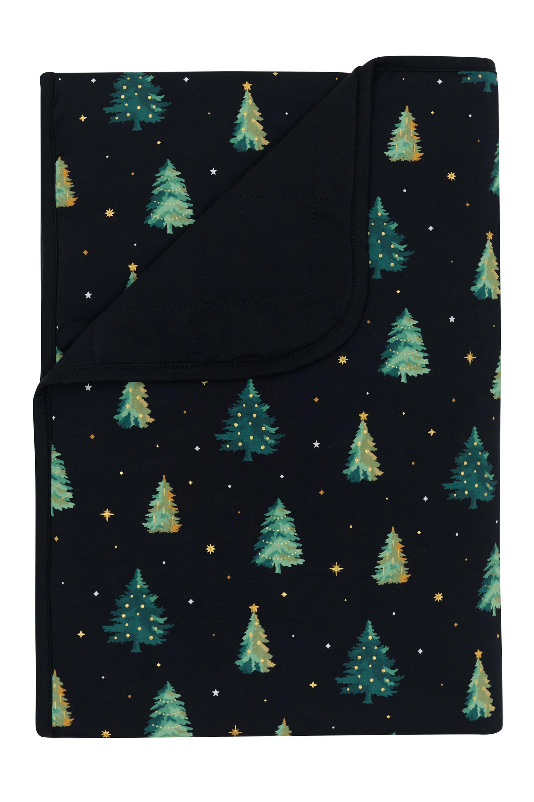 Toddler Blanket in Twinkle Tree 1.0 with the corner flipped down showing the black backing