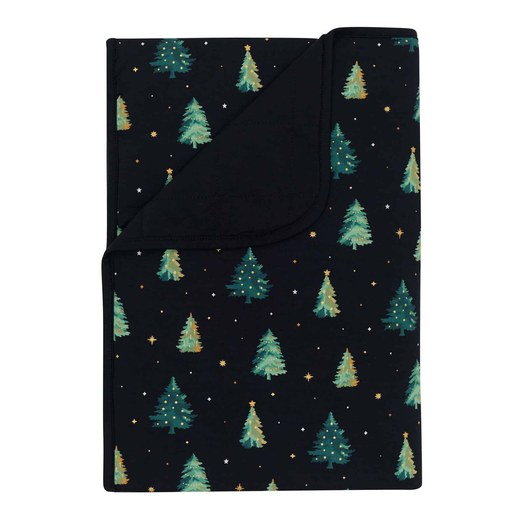 Toddler Blanket in Twinkle Tree 1.0 with the corner flipped down showing the black backing