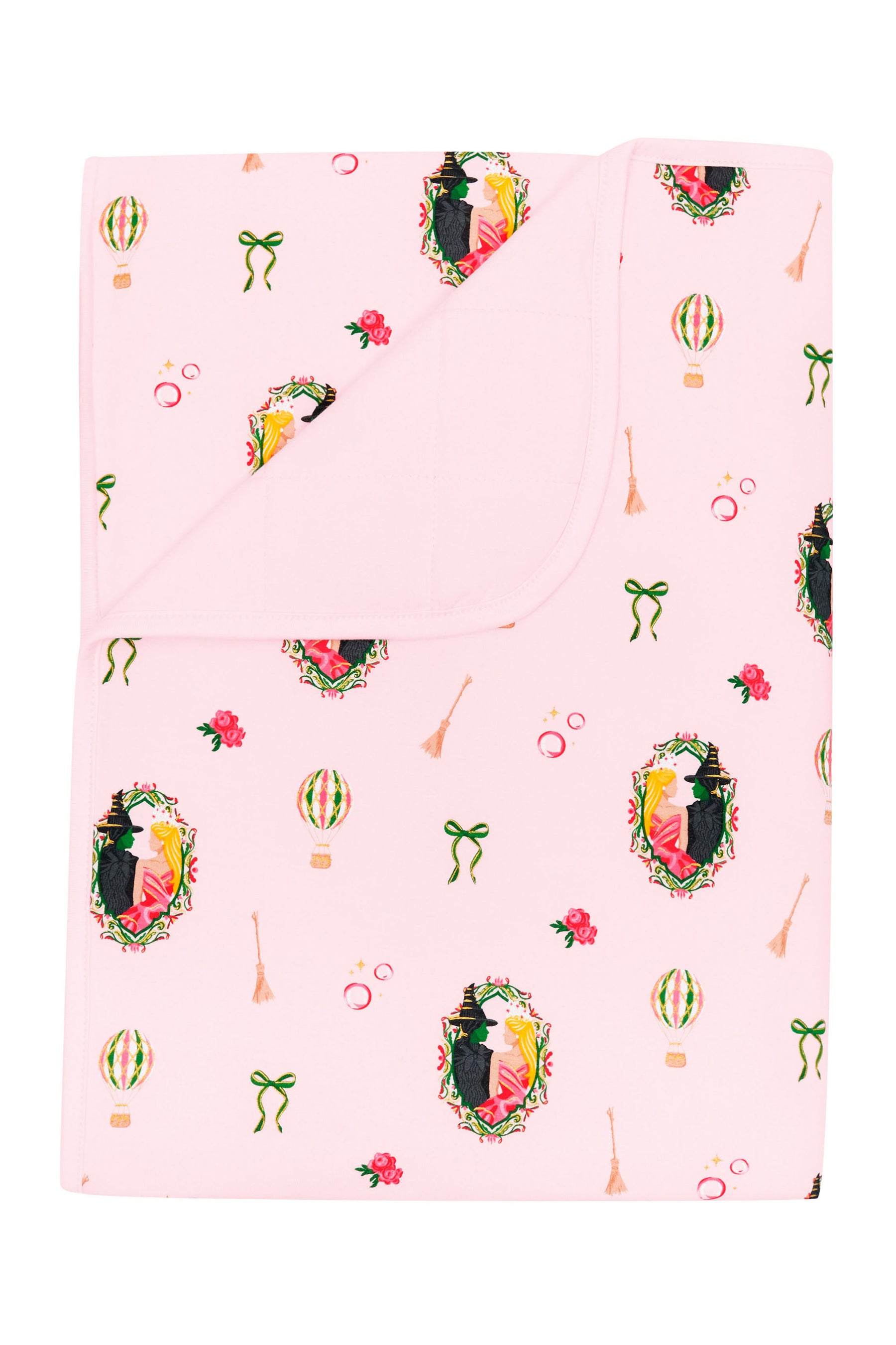 Toddler Blanket in Wicked 1.0 with the corner flipped down showing the light pink backing