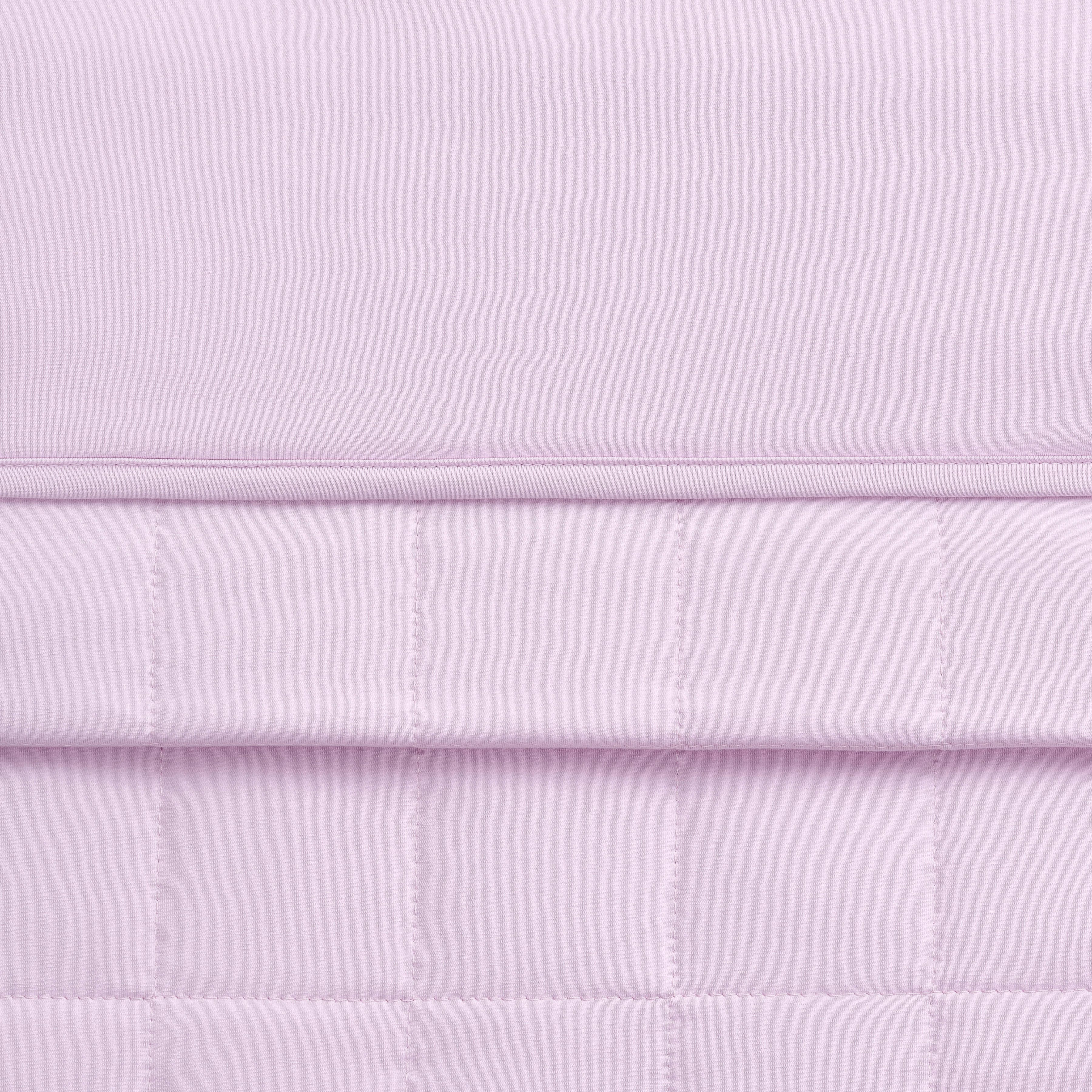 Close-up of a quilted lavender blanket 