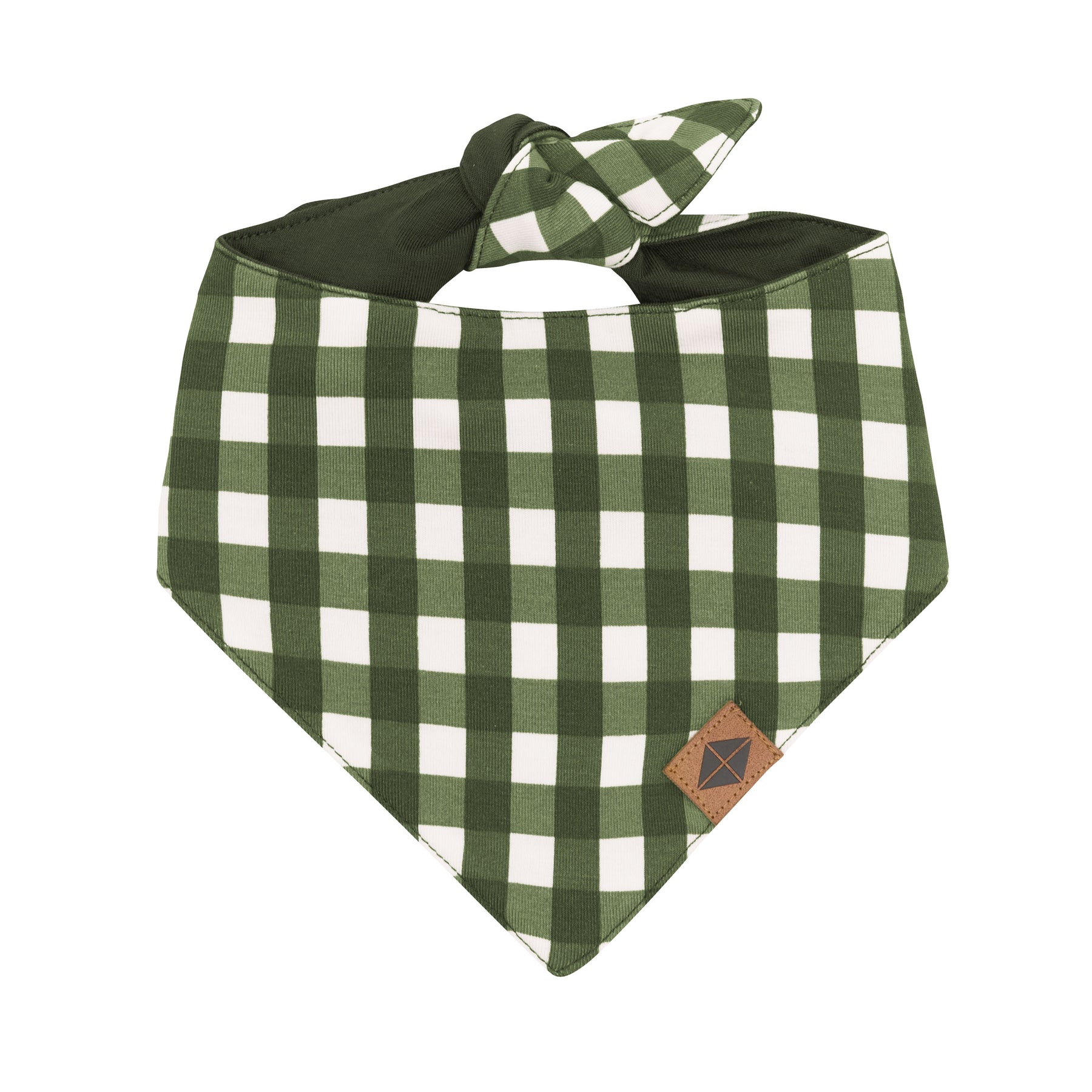 Front of the Dog Bandana in Gingham Fir with the Kyte Baby vegan leather tag visible