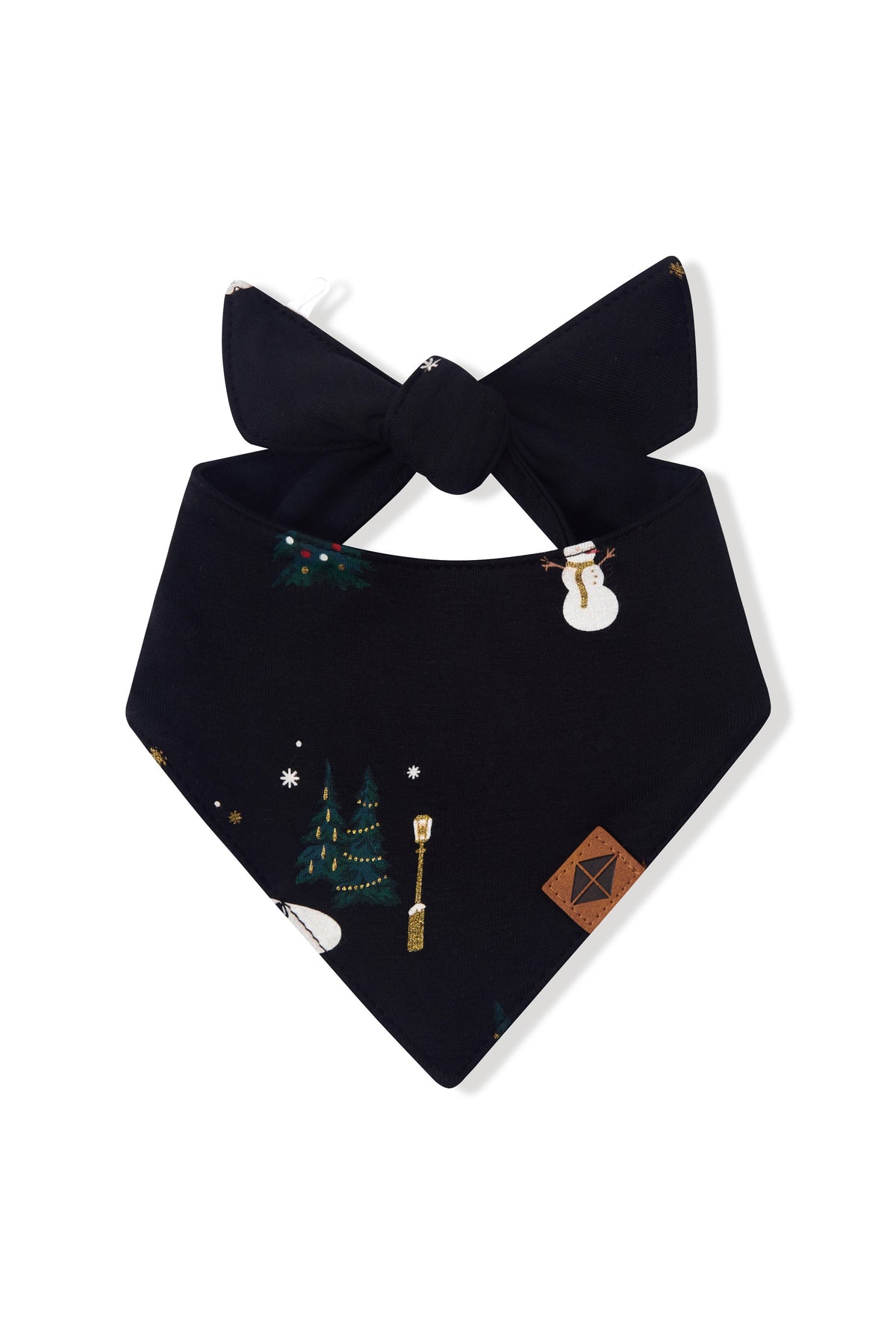 A black dog bandana with a bow, decorated with small Christmas-themed illustrations including a pine tree, snowman, stars, and a gold spoon, shown on a plain white background.