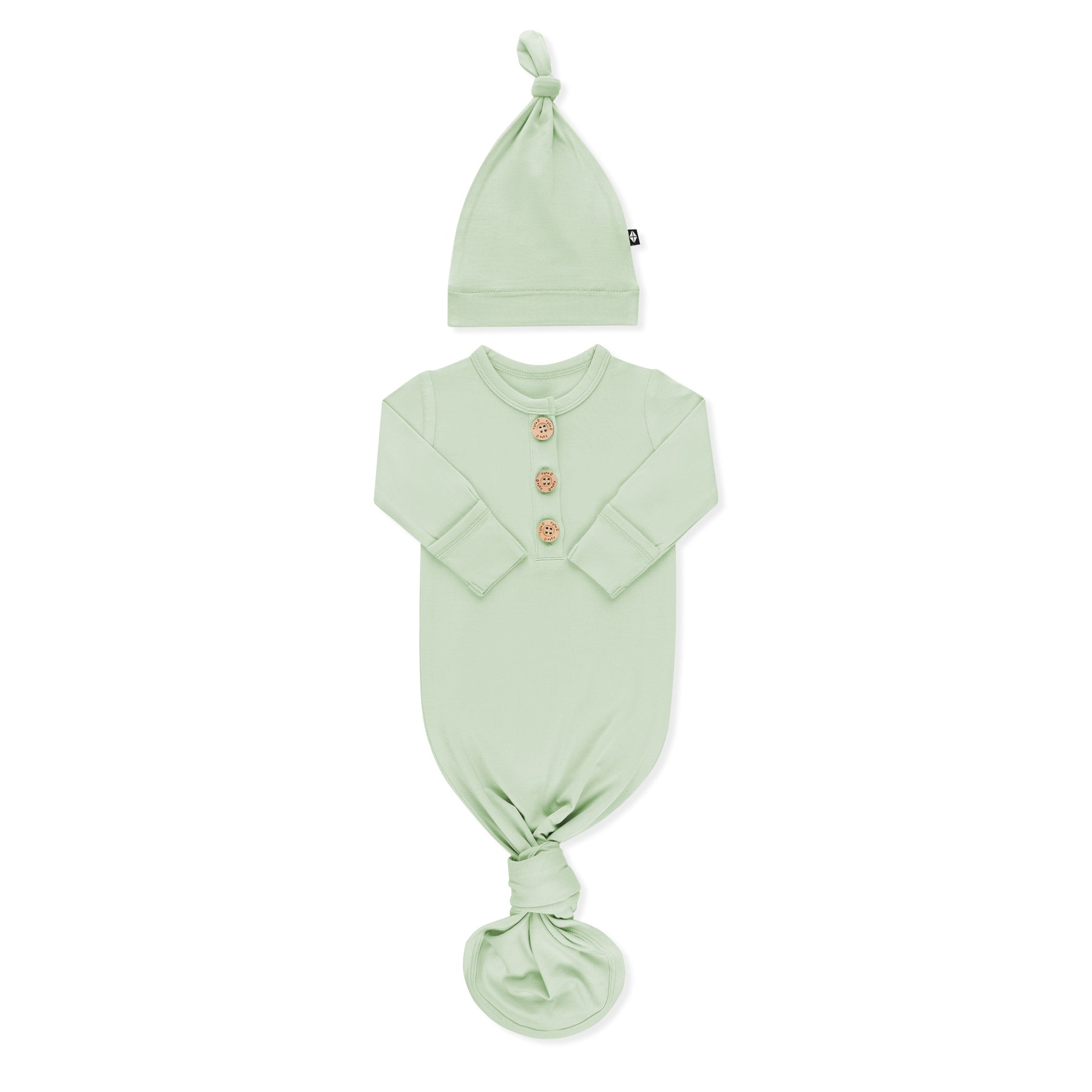 Product photo of the Knotted Gown with Hat Set in Basil with the arms folded inwards