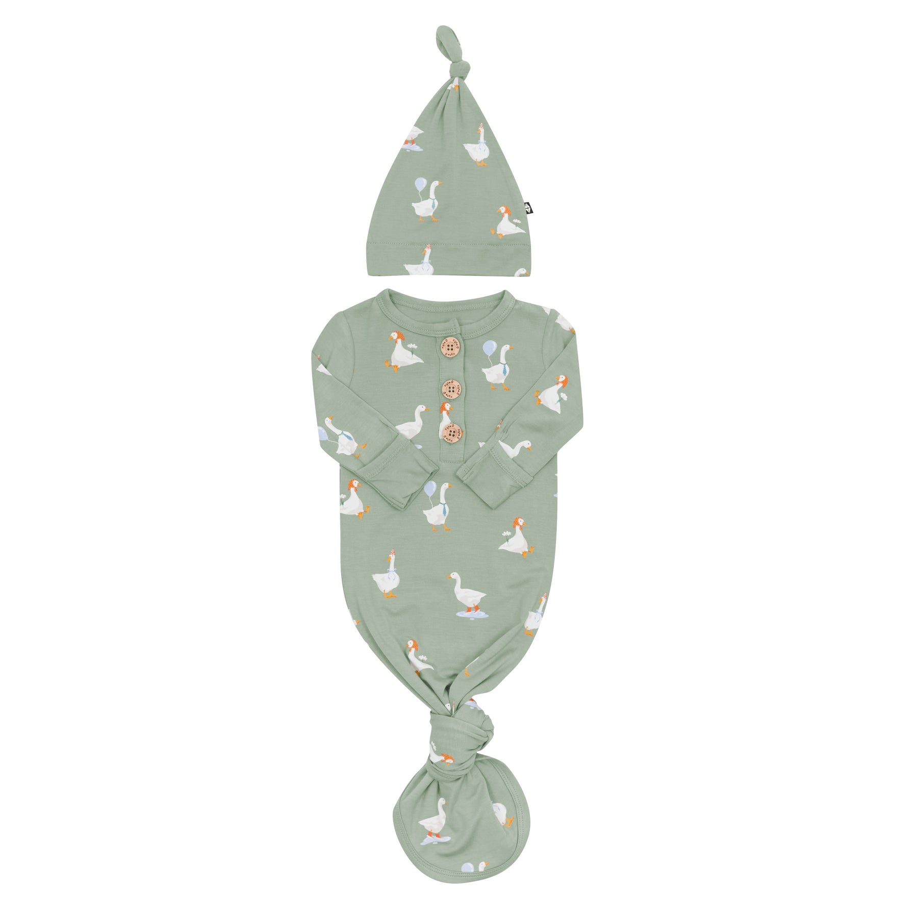 Knotted Gown with Hat Set in Silly Goose showing the gown tied at the bottom with the arms folded inward