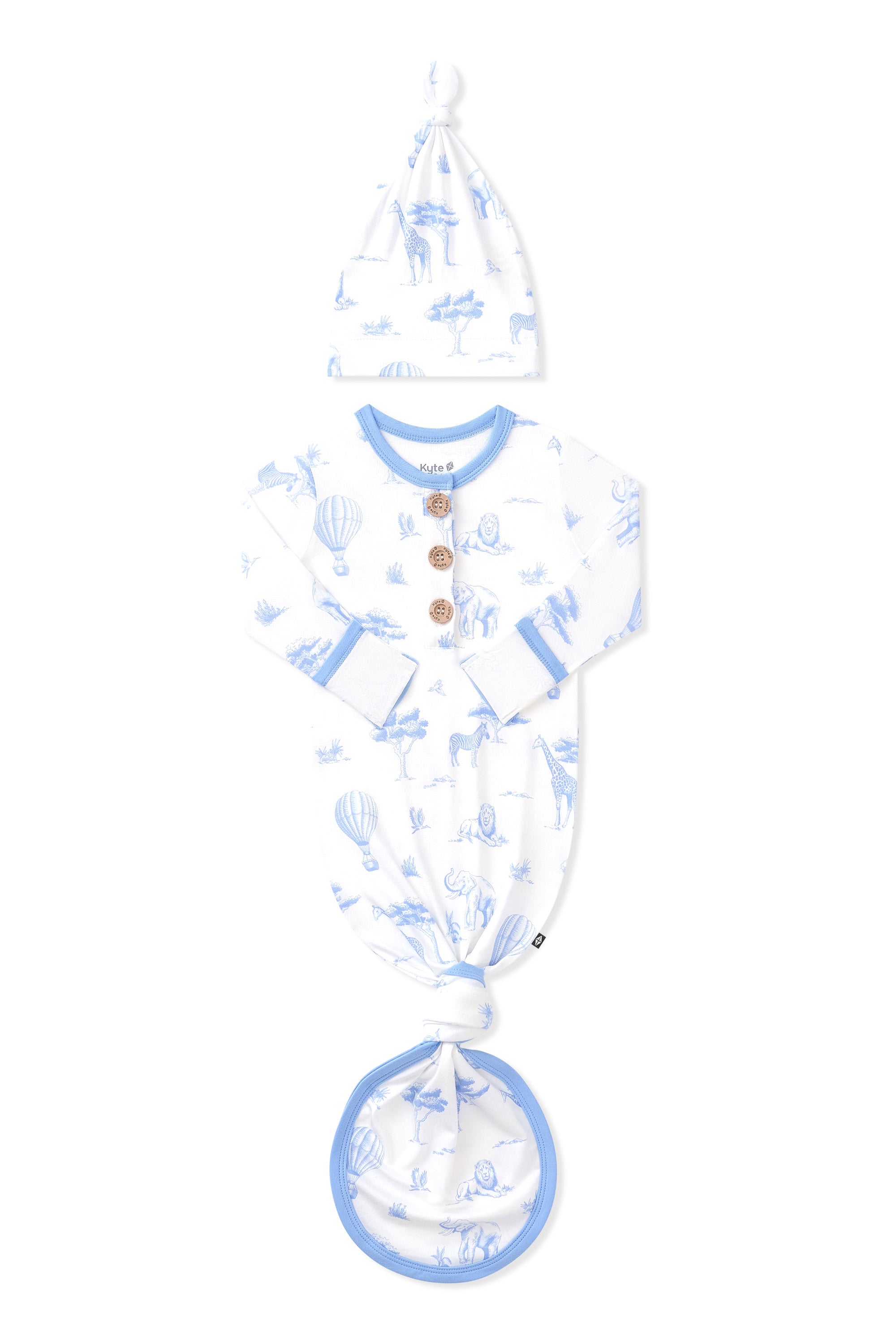 Knotted Gown with Hat Set in Toile Safari shown with the arms folded inwards on a white surface