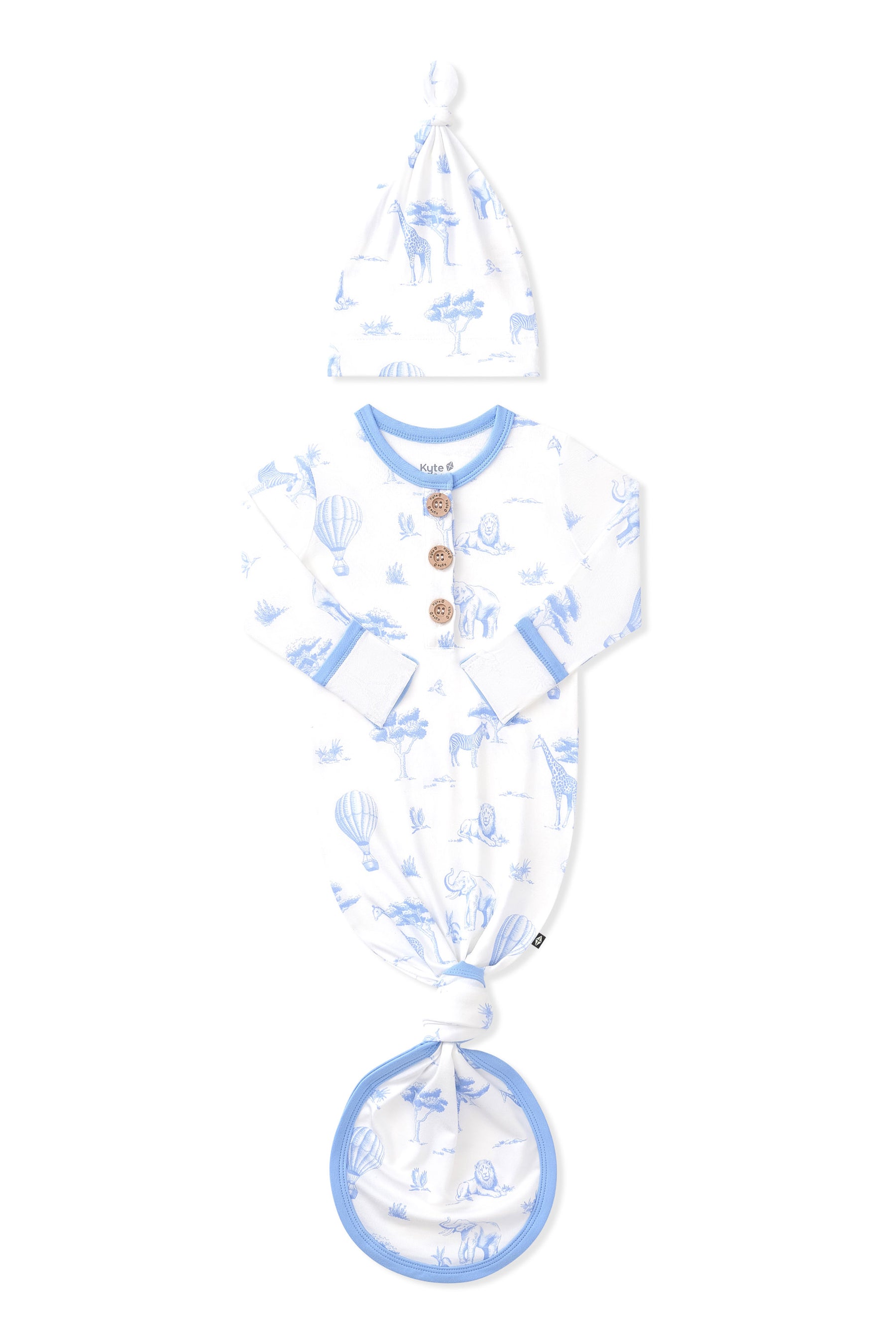 Knotted Gown with Hat Set in Toile Safari shown with the arms folded inwards on a white surface