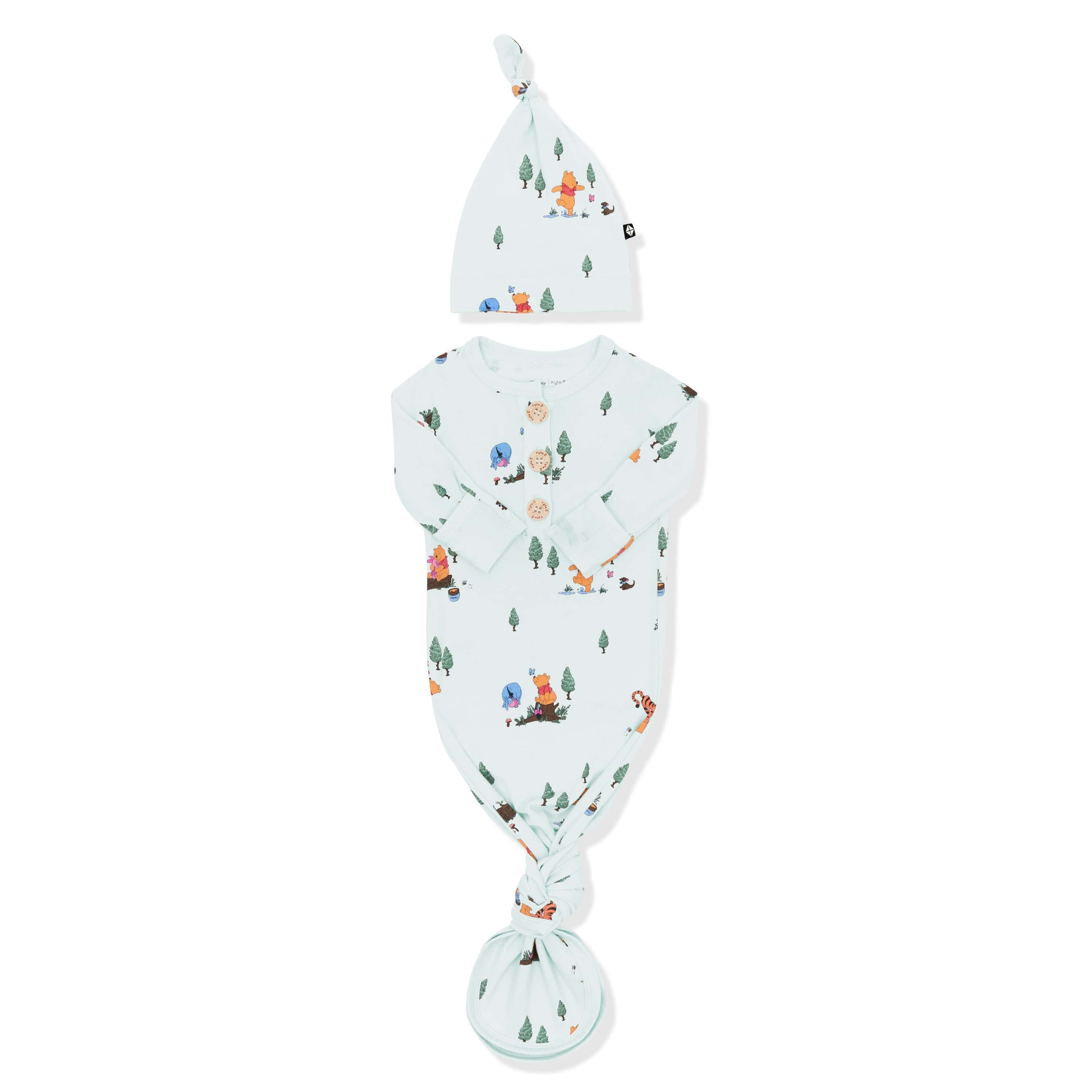 Knotted Gown with Hat Set in Winnie the Pooh Hundred Acre Wood with the arms folded inwards shown on a white surface