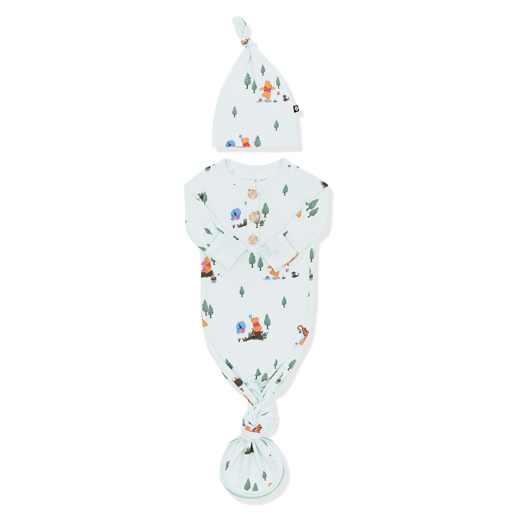 Knotted Gown with Hat Set in Winnie the Pooh Hundred Acre Wood with the arms folded inwards shown on a white surface