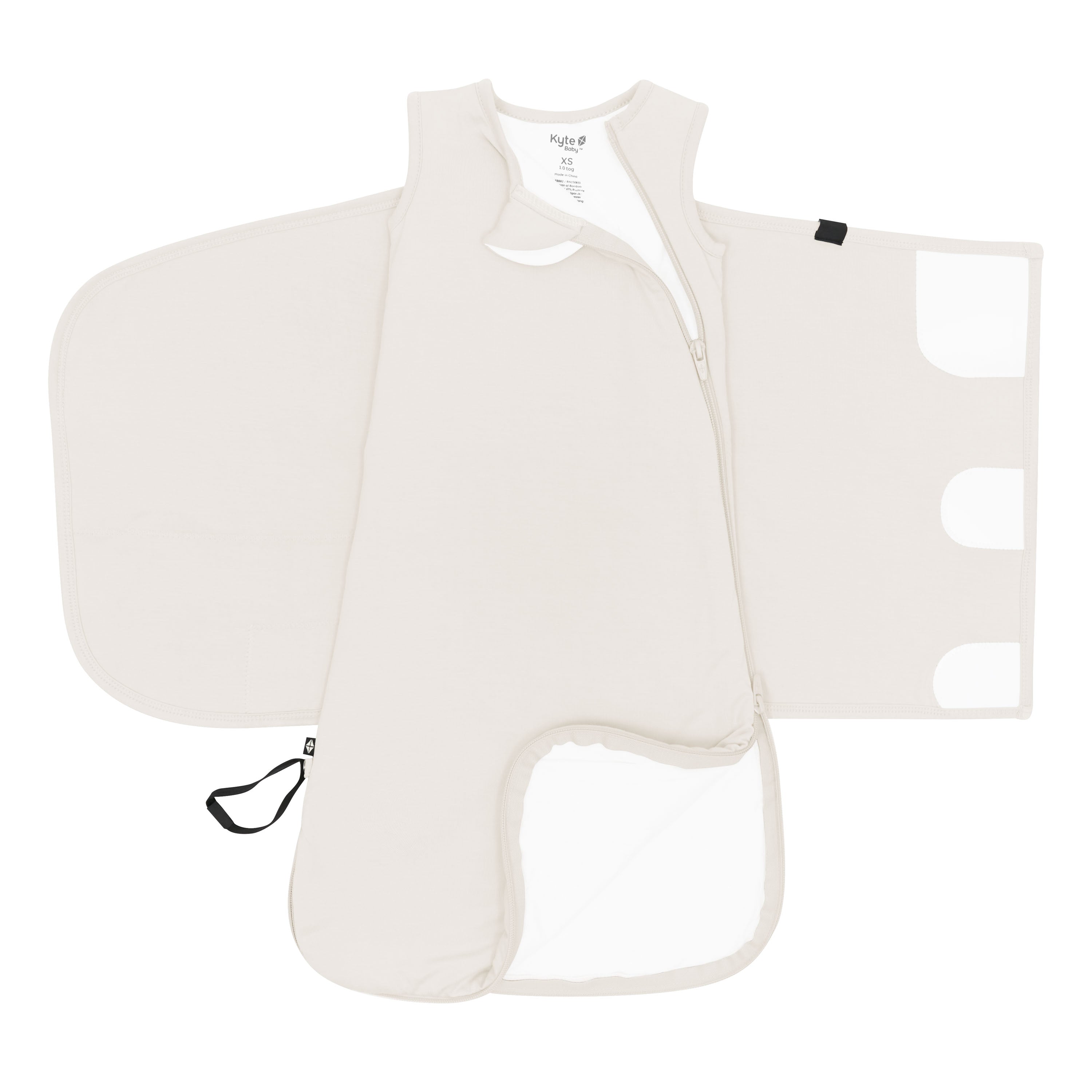 Zipper garage, double zipper and adjustable velcro shown on an unswaddled Sleep Bag Swaddler in Oat 1.0