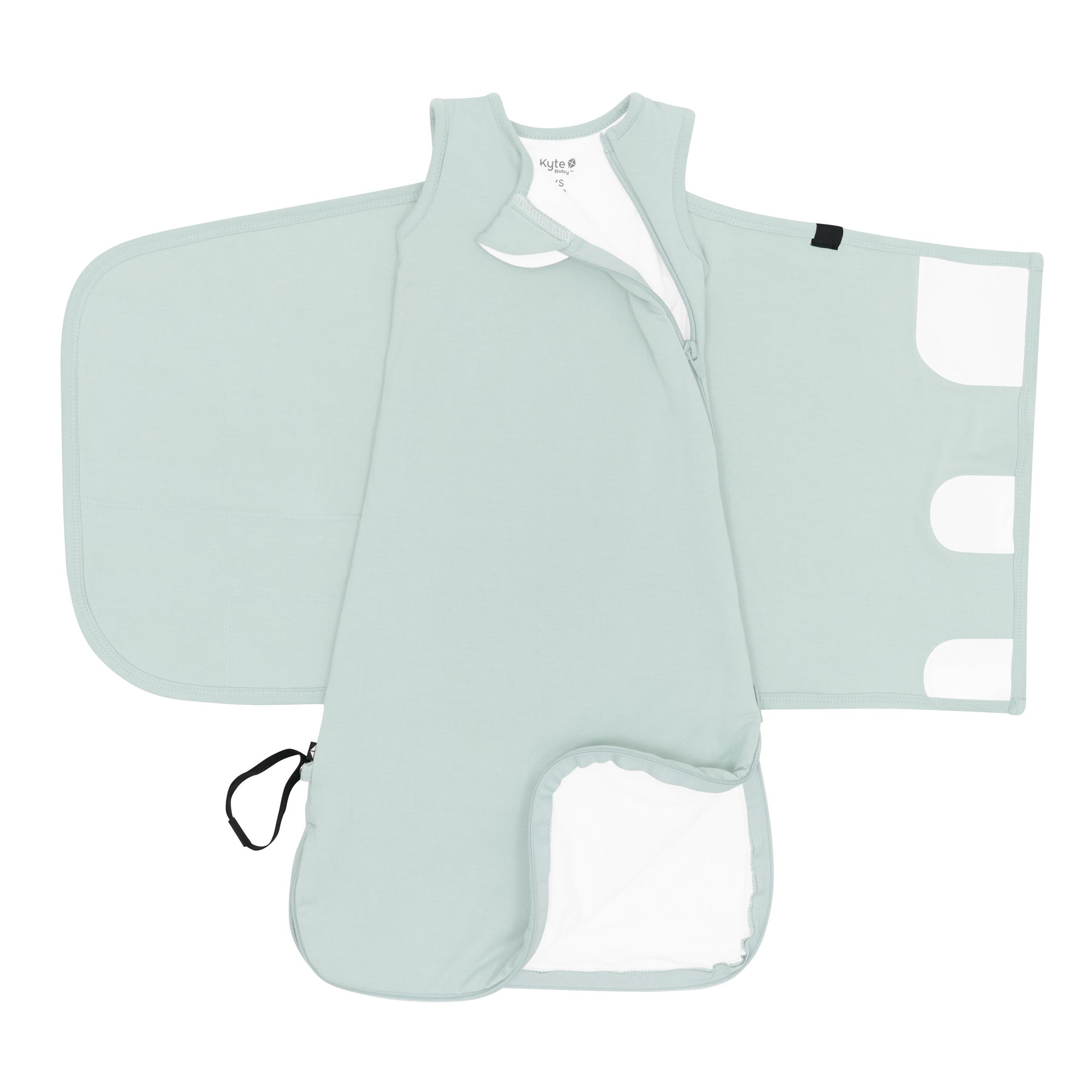 Zipper garage, double zipper and adjustable velcro band visible on an unswaddled Sleep Bag Swaddler in Sage 1.0