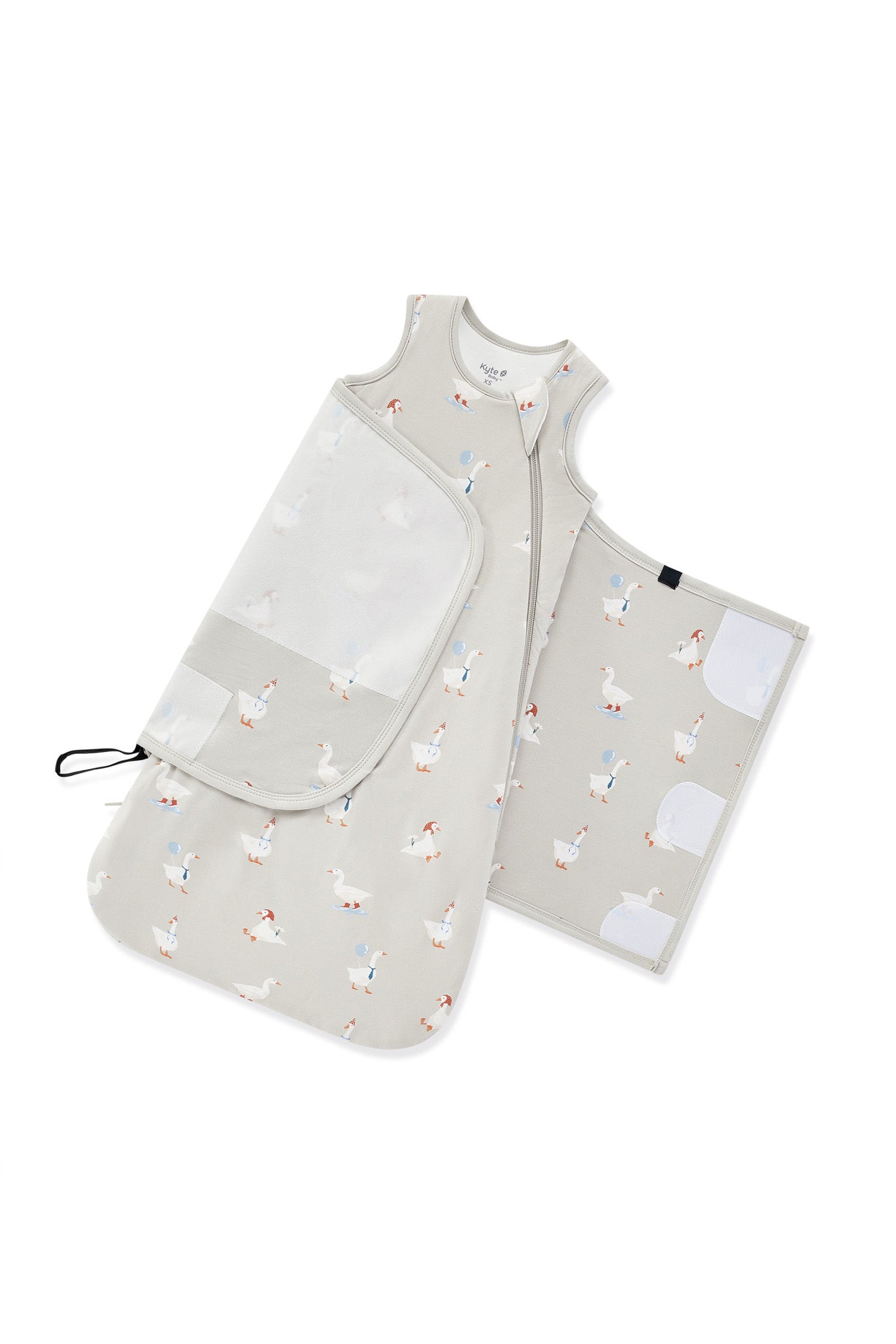 Adjustable velcro strap shown on an unswaddled Sleep Bag Swaddler in Oat Silly Goose 1.0 print on a white background