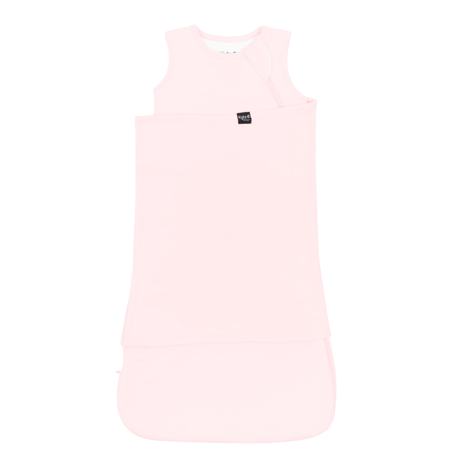 Sleep Bag Swaddler in Sakura 1.0 shown swaddled with the Black Kyte Baby logo tag visible