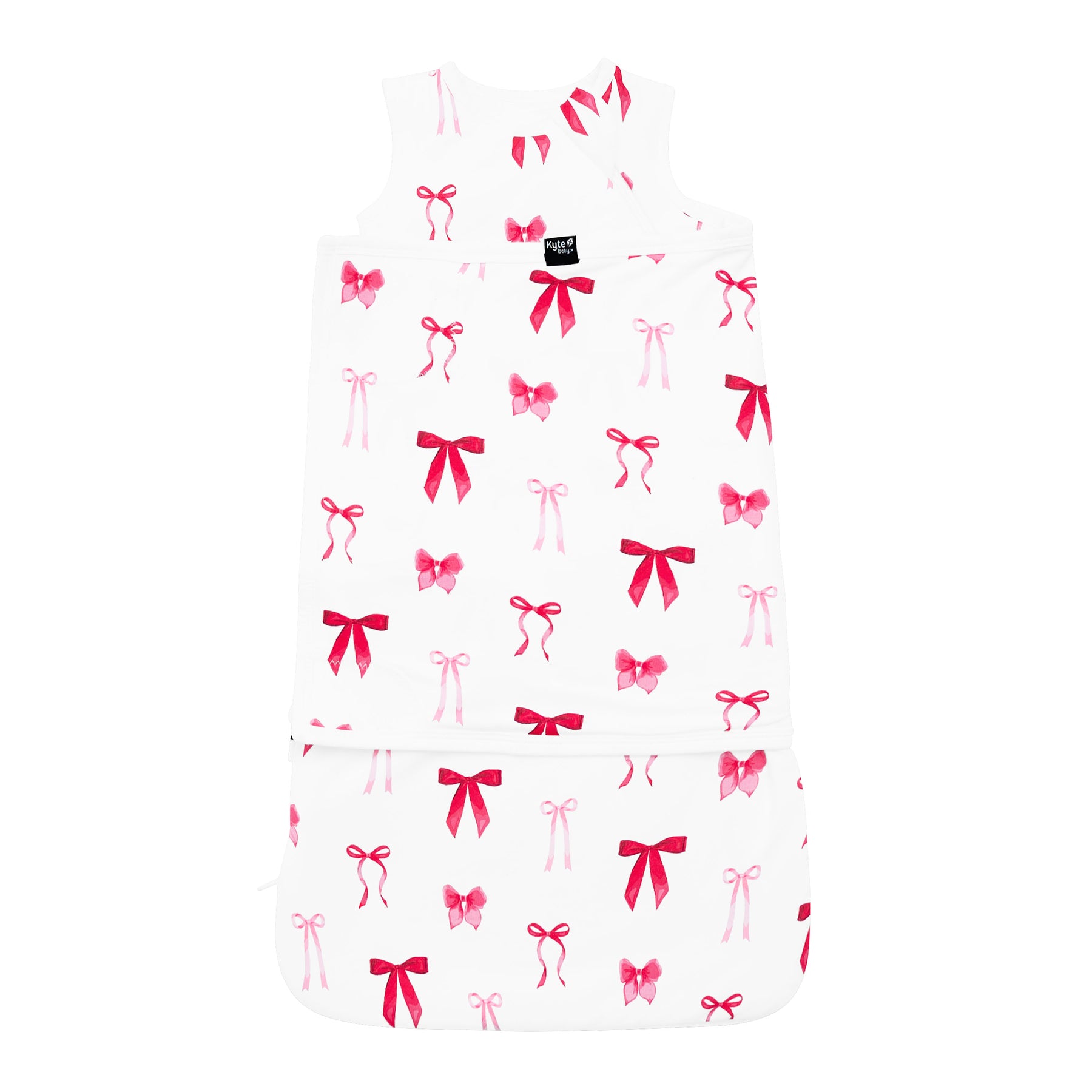 Product photo of the breathable and stretchy Sleep Bag Swaddler in Small Love Bow 1.0 shown swaddled