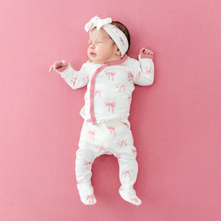Newborn baby wearing Lulla Babys patterned outfit