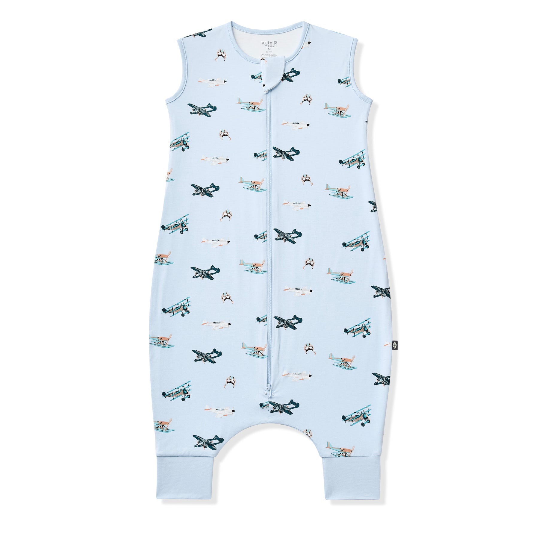 Sleep Bag Walker in Take Off 0.5 shown zipped up on a white surface