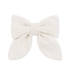 Large cream-colored bow on a white background