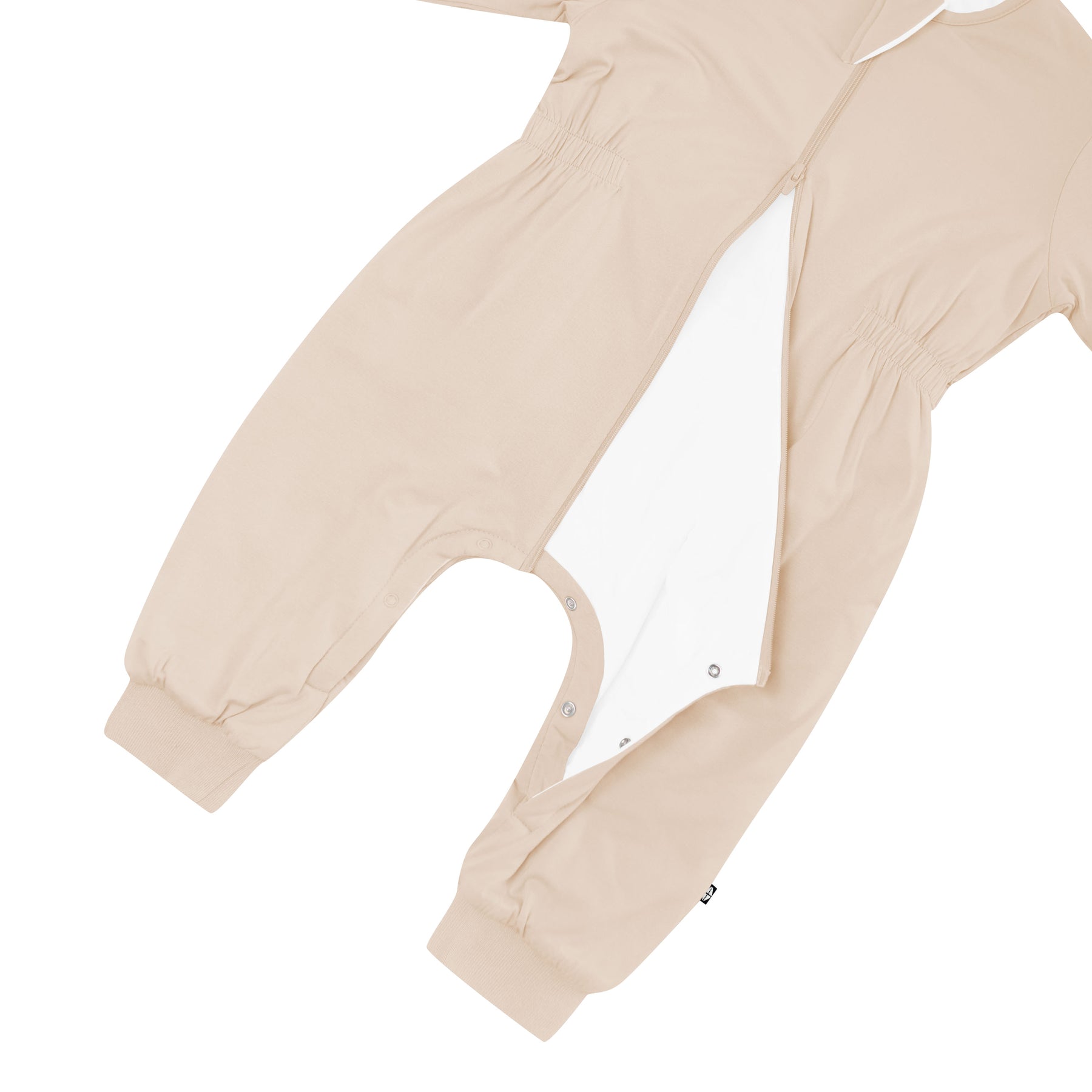 Inseam snaps, cinched waist and dual zipper shown on the Cozy Playsuit in Bisque