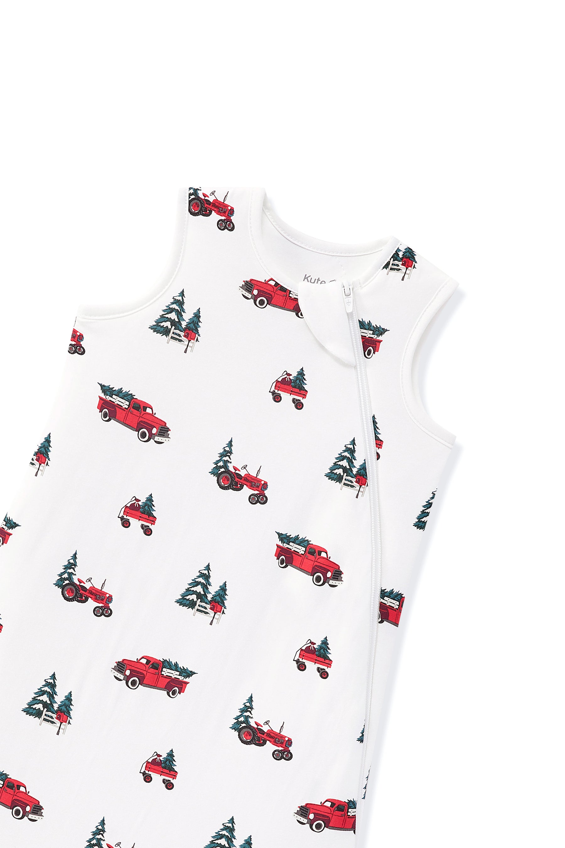 A sleeveless white baby sleep sack with a front zipper, featuring an all-over print of red pickup trucks and green Christmas trees.