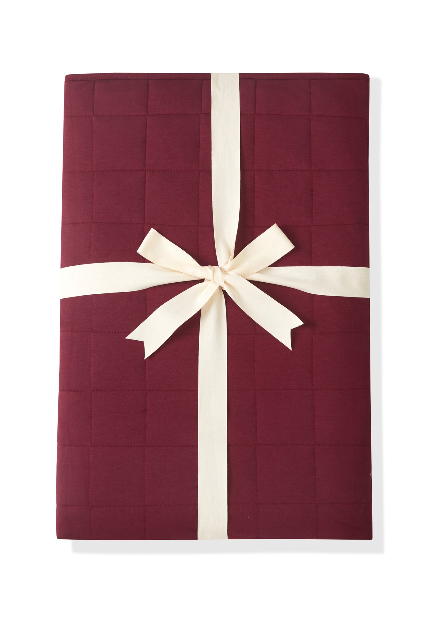 Adult Quilted Blanket in Burgundy 2.5 packed with a ribbon on a white background