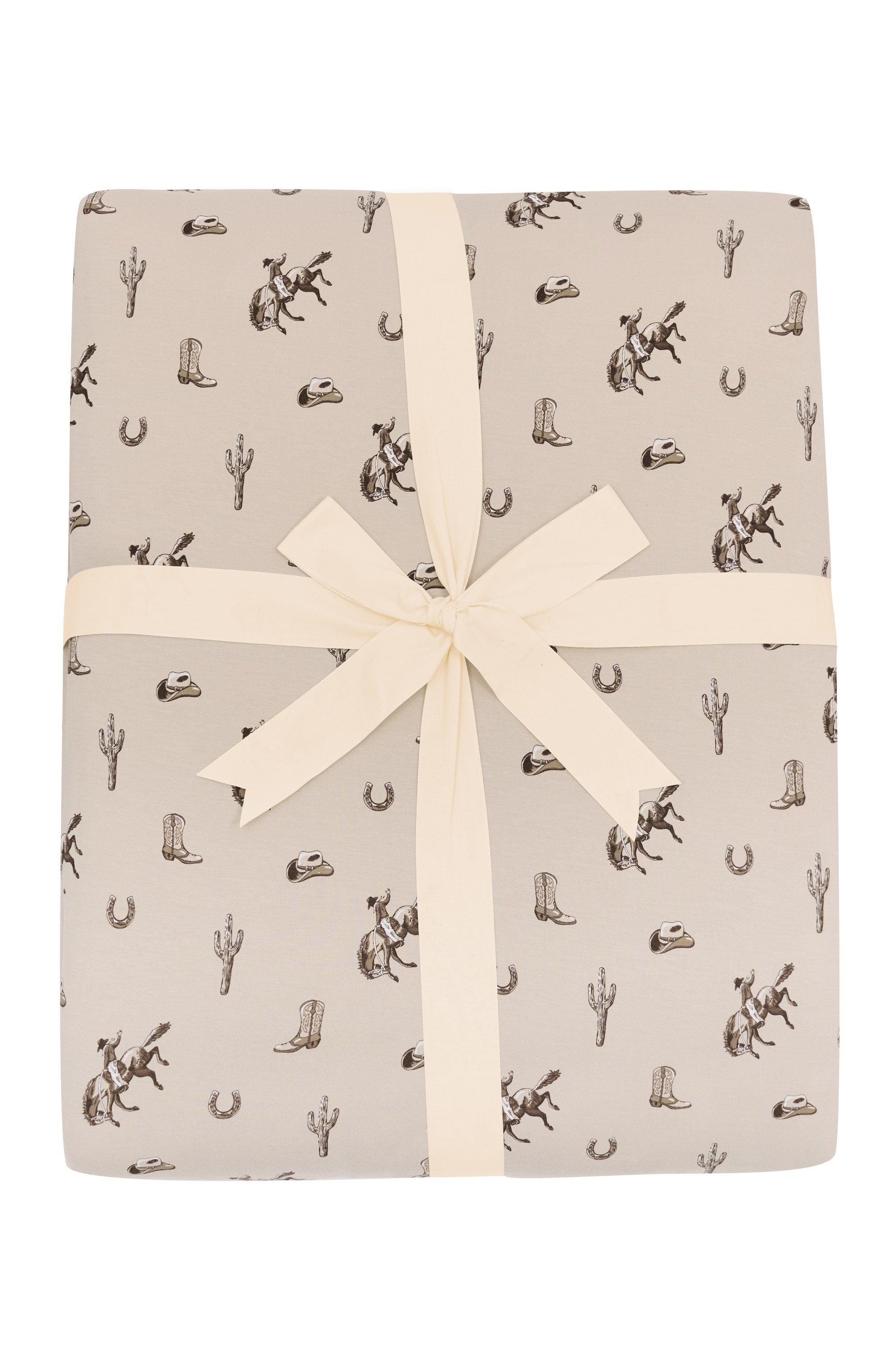 Product photo of the Adult Quilted Blanket in Classic Cowboy 2.5 shown tied in its packaging with a linen bow
