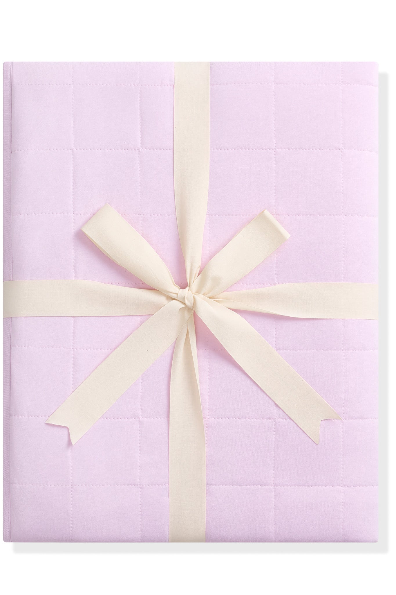 Purple quilted blanket with a cream ribbon on a white background