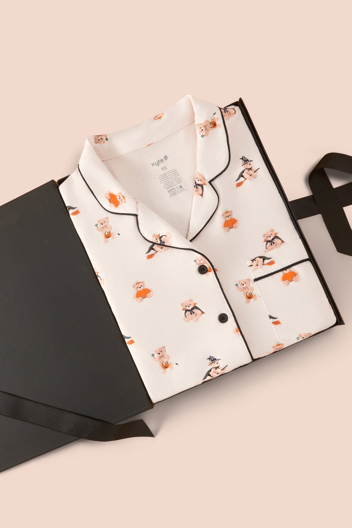 Long-Sleeved Women's Pajama Set in Halloween Teddy print packed in a box on a beige background