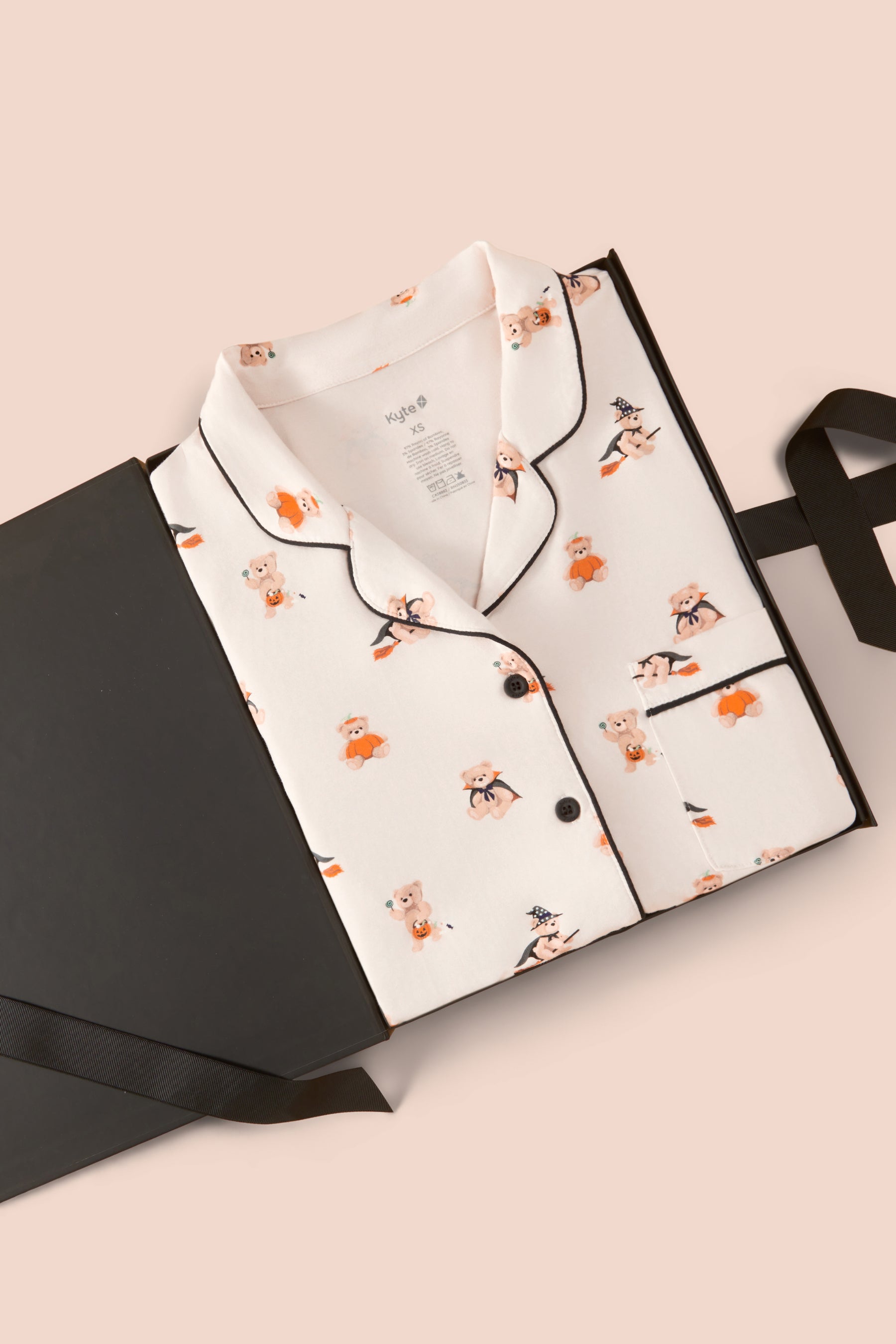 Long-Sleeved Women's Pajama Set in Halloween Teddy print packed in a box on a beige background