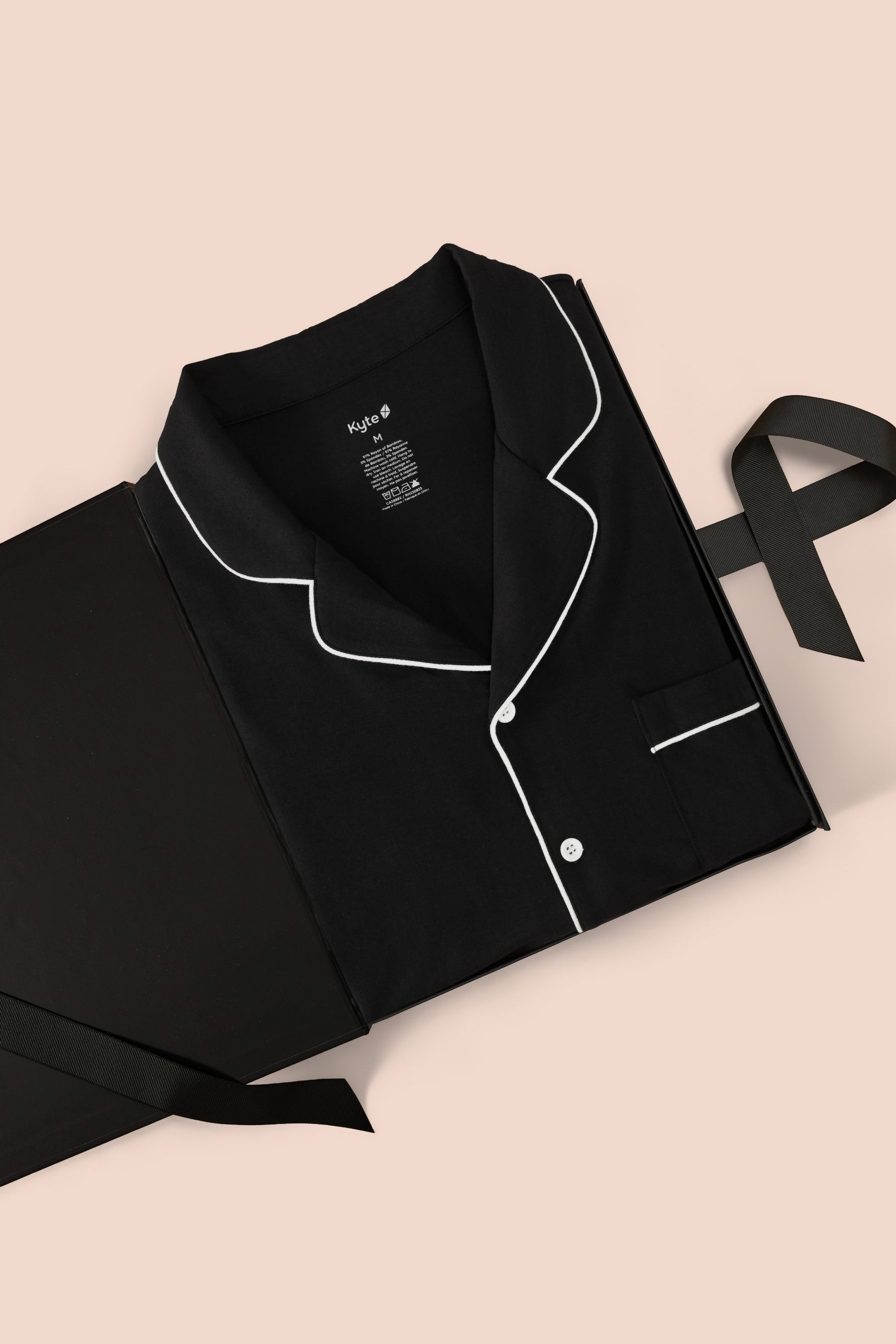 Men's Long Sleeve Pajama Set in Midnight packed in a box on a beige background