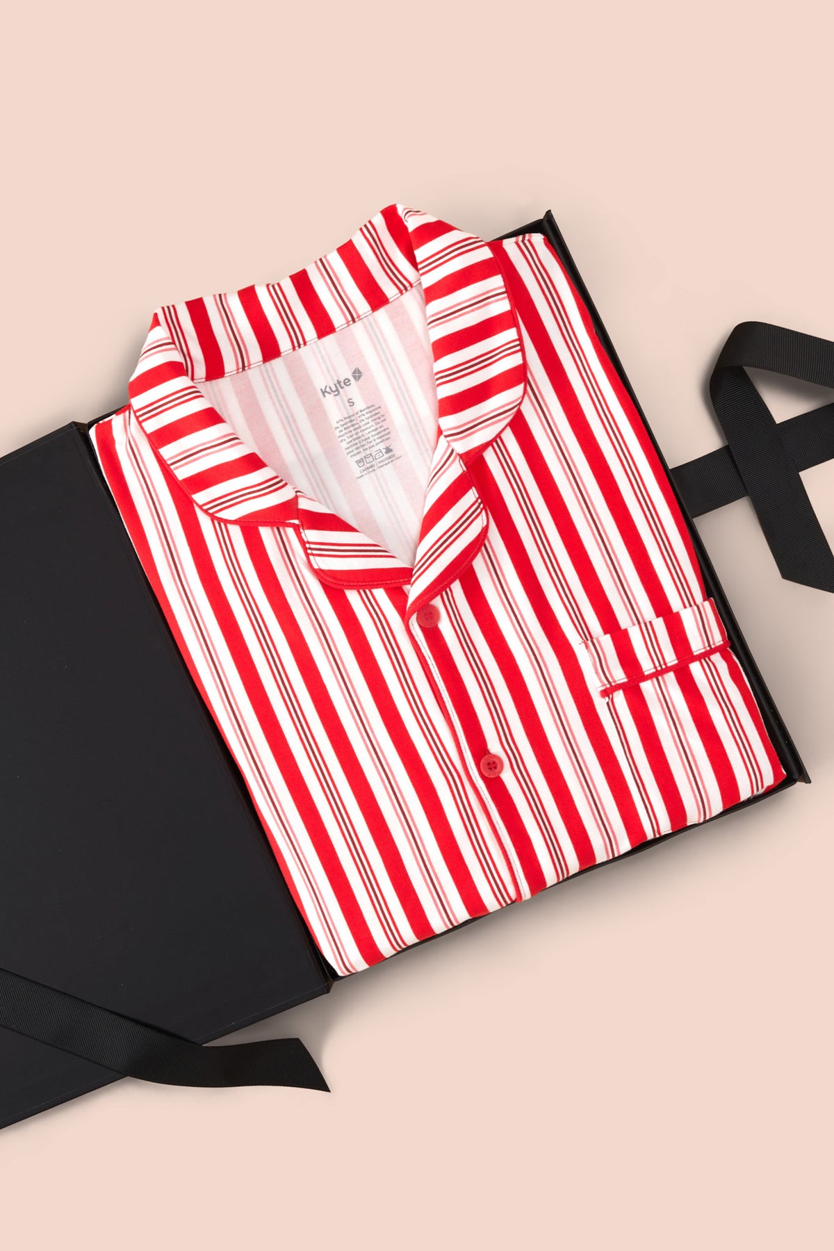 Men's Long Sleeve Pajama Set in red and white Peppermint Stripes print packed in a box on a beige background