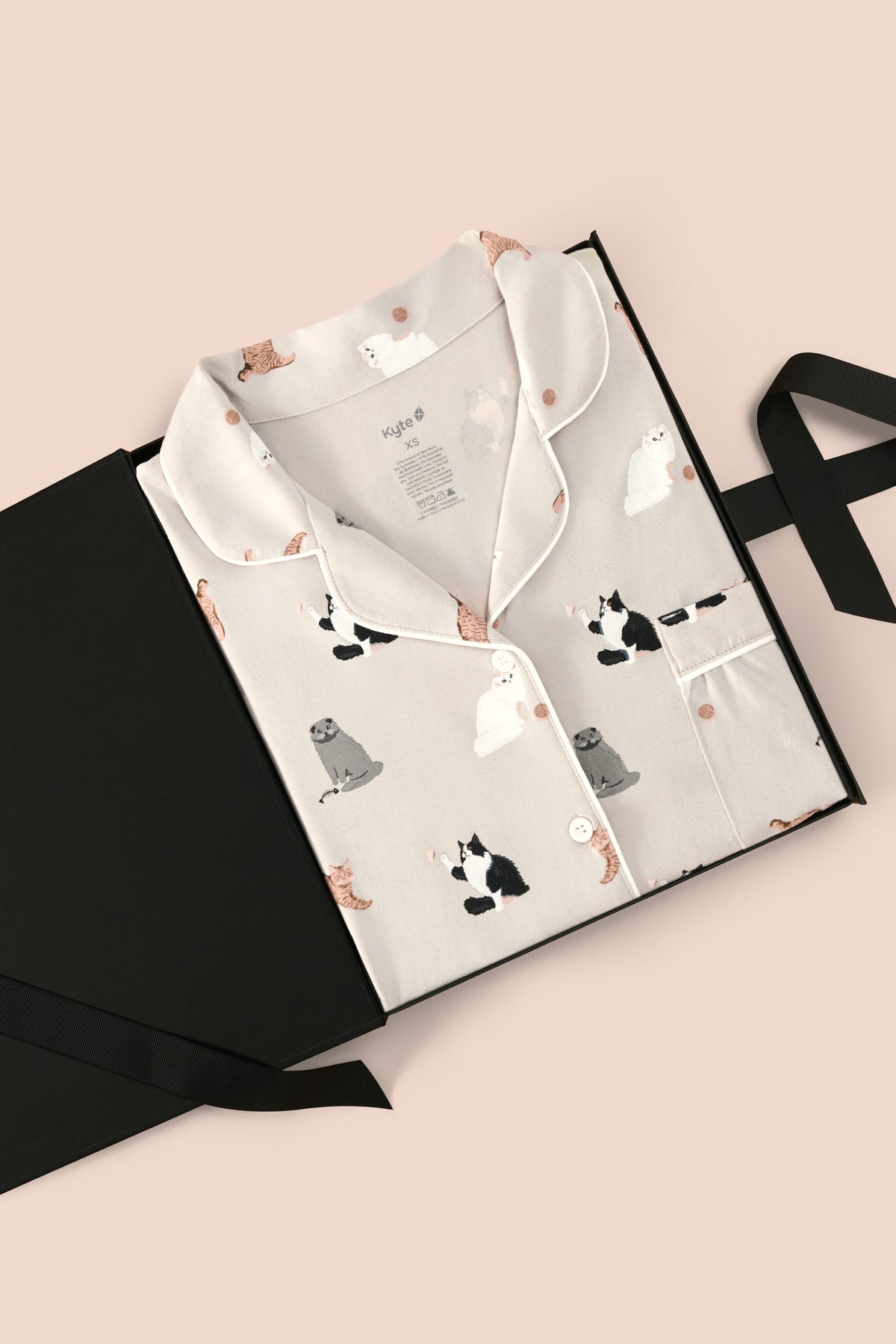 Women's Short Sleeve Pajama Set in Fluffy Cat print packed in a box on a beige background