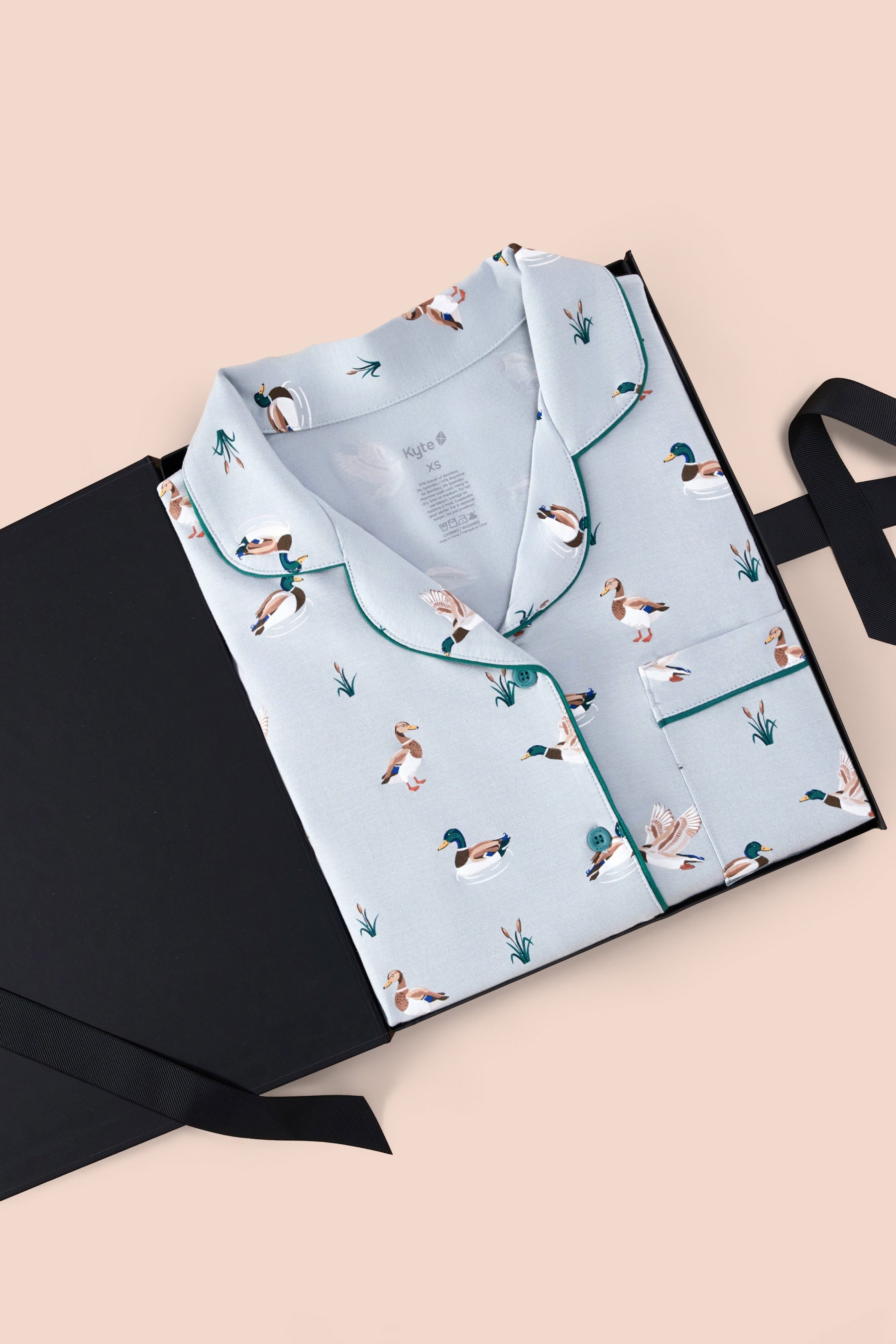 Women's Short Sleeve Pajama Set in Mallard Duck print packed in a box on a beige background