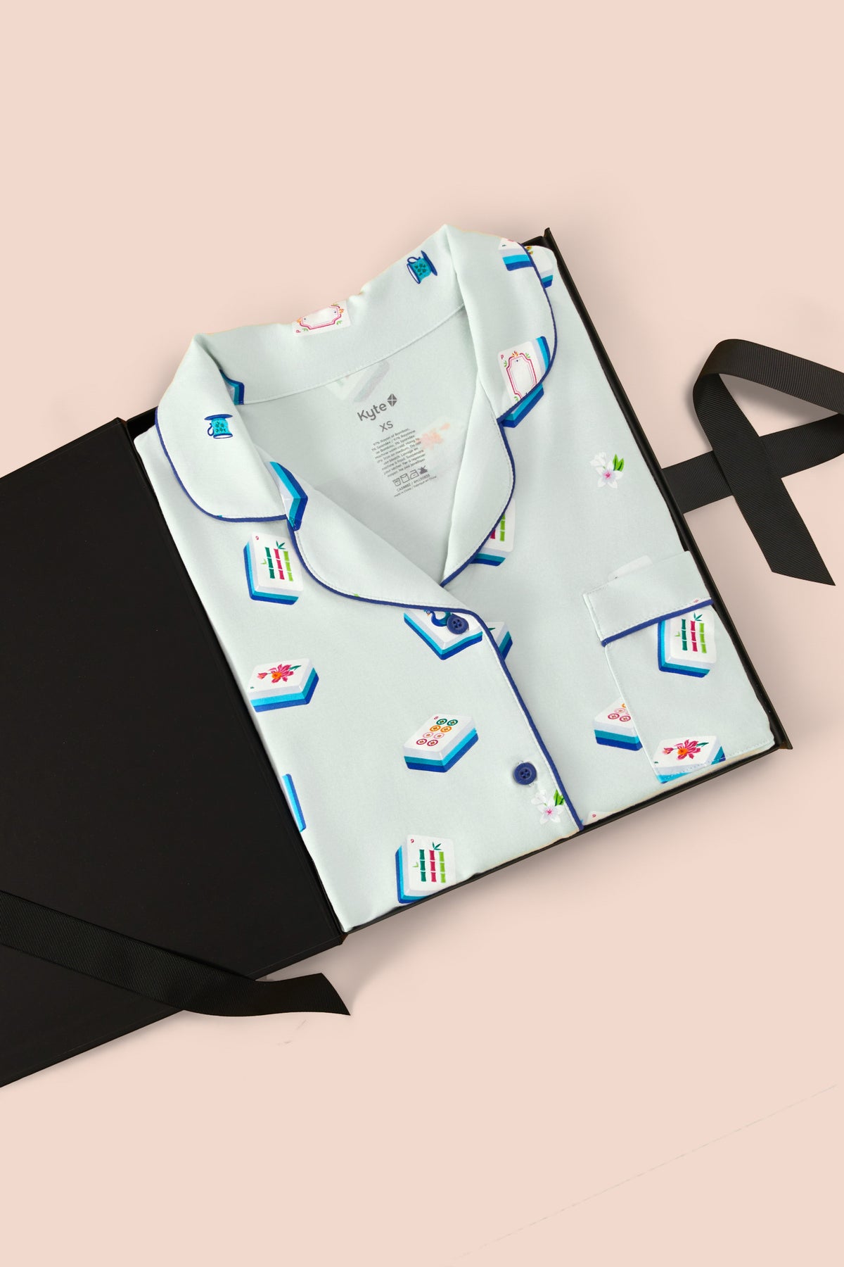 Women's Short Sleeve Pajama Set in Dew Mahjong print packed in a box on a beige background