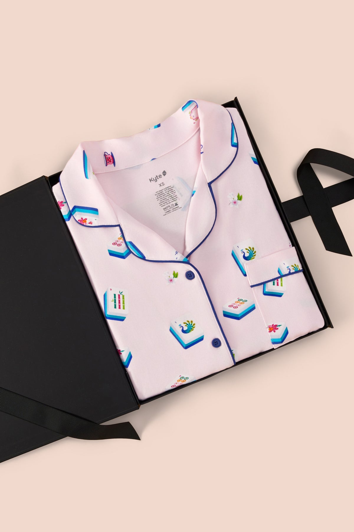 Long-Sleeved Women's Pajama Set in Sakura Mahjong print packed in a box on a beige background