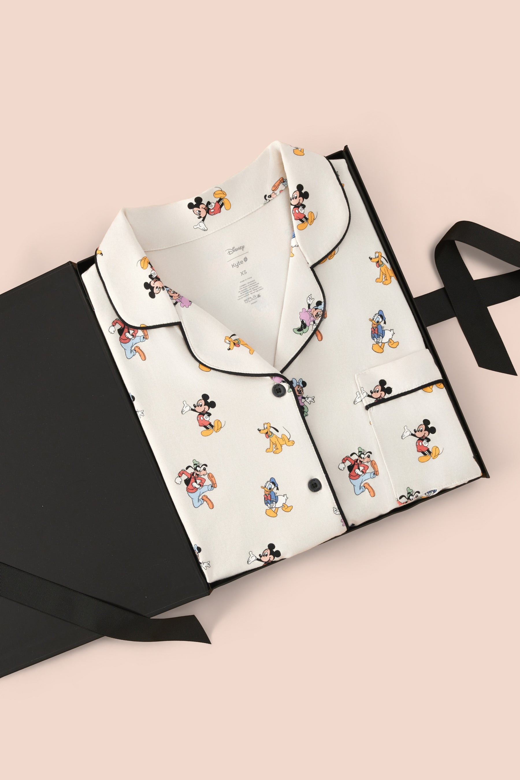 Women's Short Sleeve Pajama Set in Mickey Mouse & Friends packed in a box on a beige background