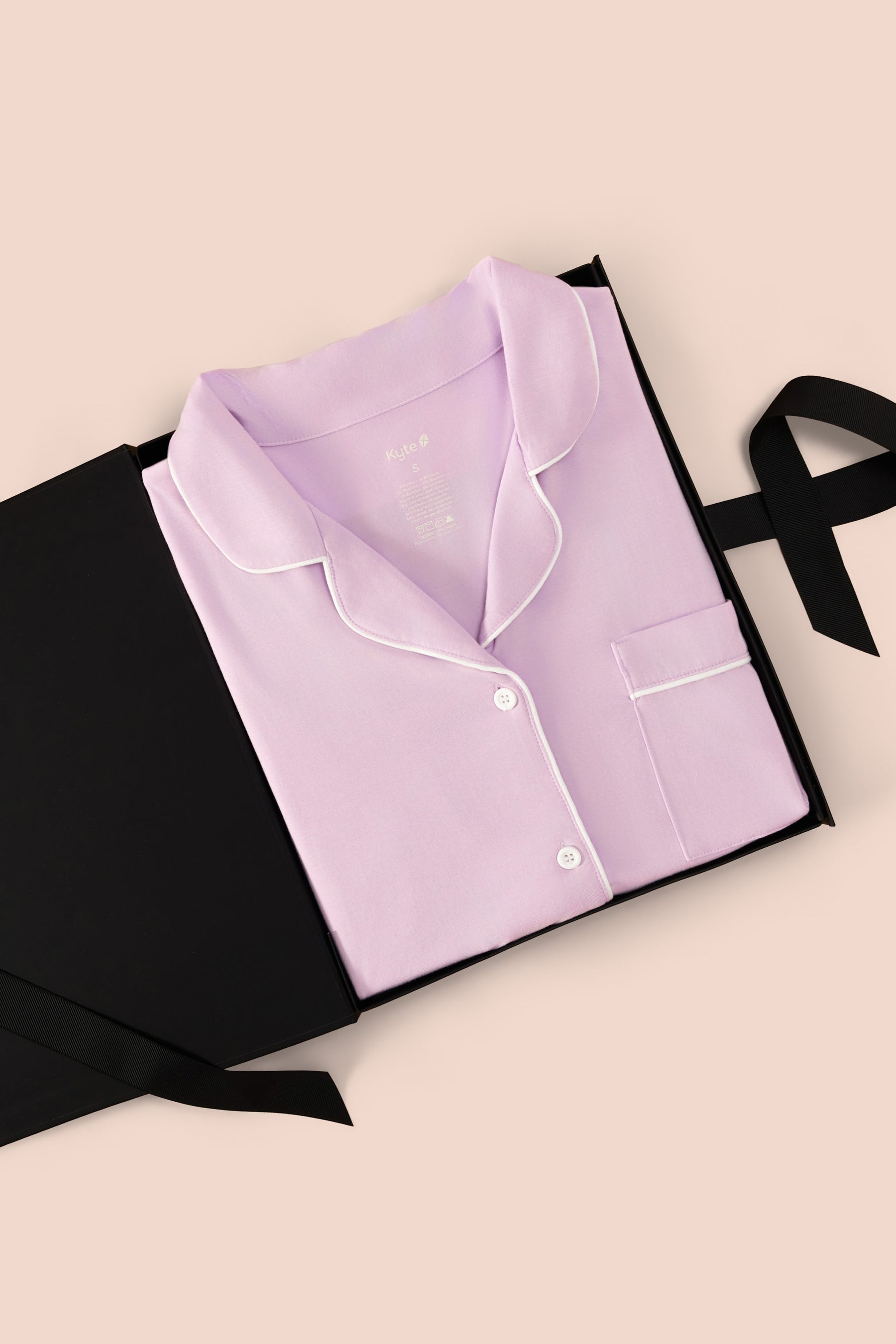 Long-Sleeved Women's Pajama Set in Thistle packed in a box on a beige background