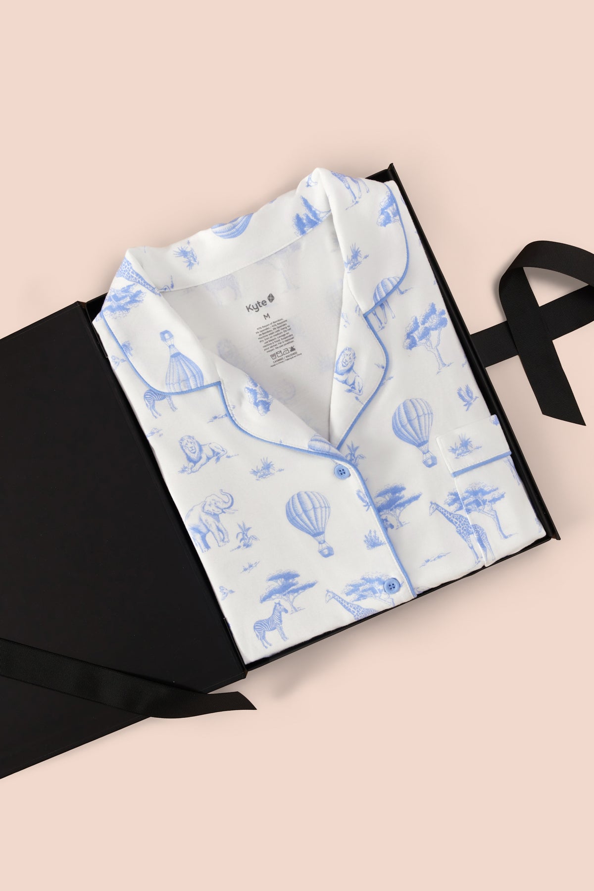 Women's Short Sleeve Pajama Set in Toile Safari print packed in a box on a beige background