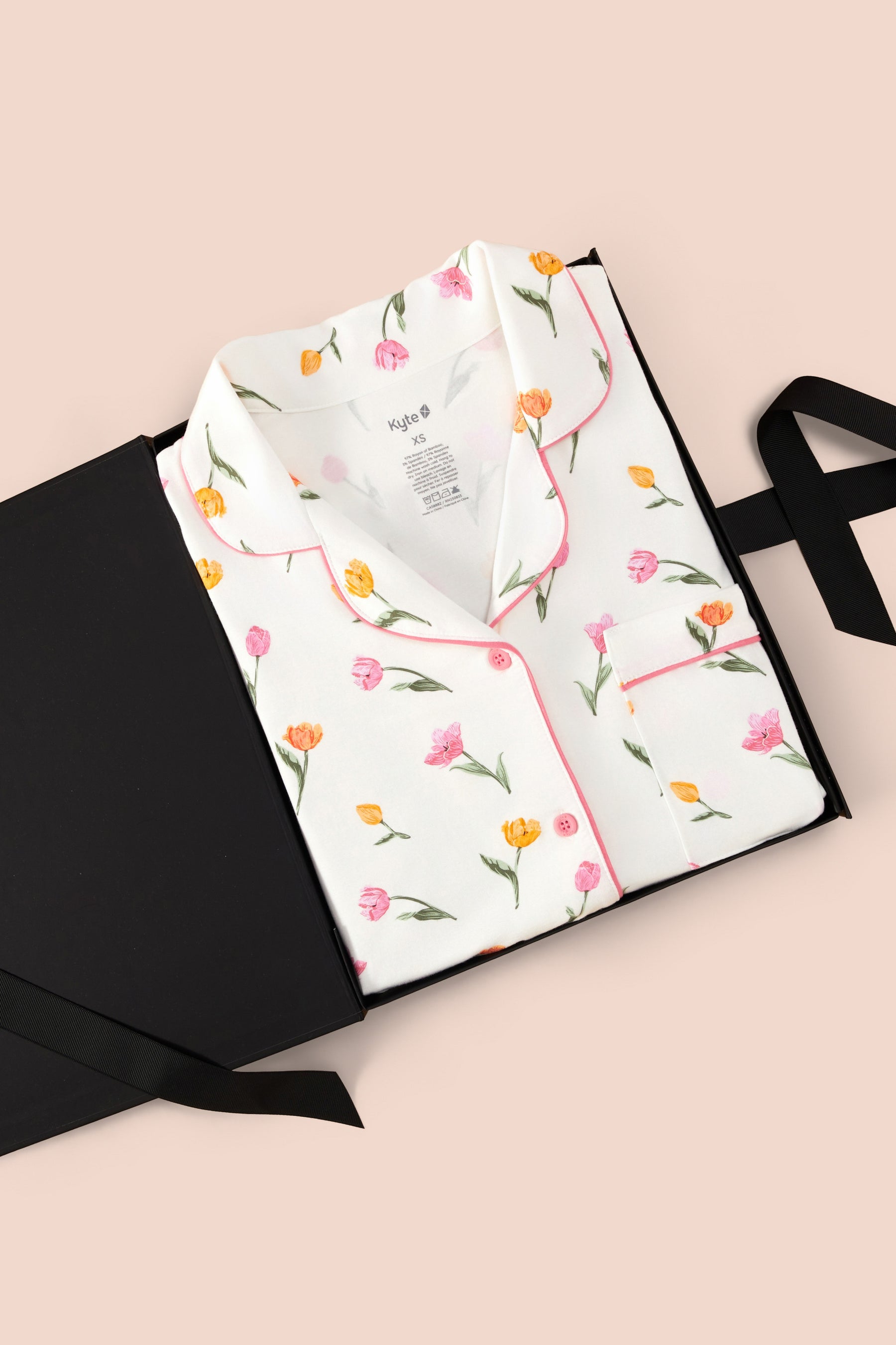 Long-Sleeved Women's Pajama Set in Tulip print packed in a box on a beige background