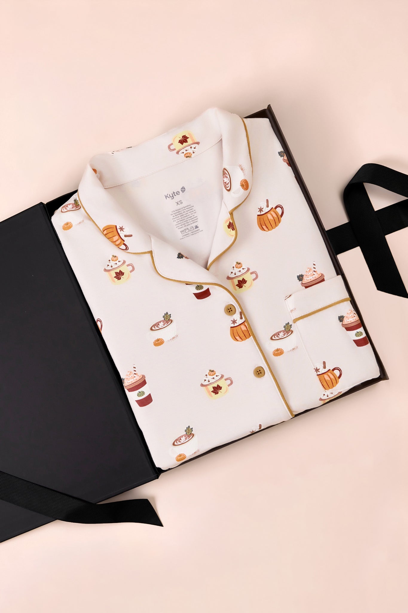 Women's Short Sleeve Cropped Pajama Set in Pumpkin Spice Latte print on a beige background